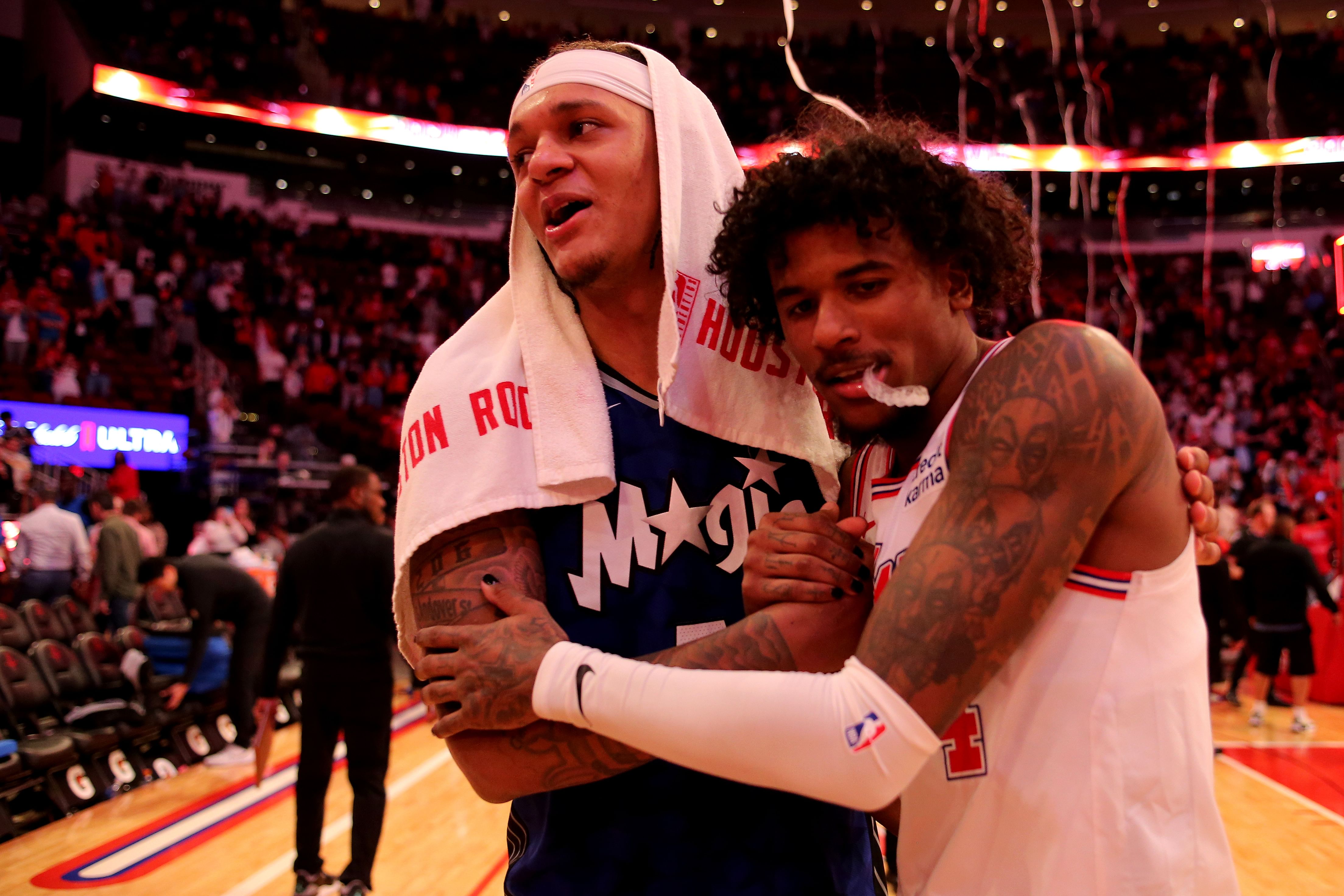 Apr 9, 2024; Houston, Texas, USA; Orlando Magic forward Paolo Banchero (5) and Houston Rockets guard Jalen Green (4) greet each other following the game at Toyota Center. Mandatory Credit: Erik Williams-Imagn Images - Source: Imagn