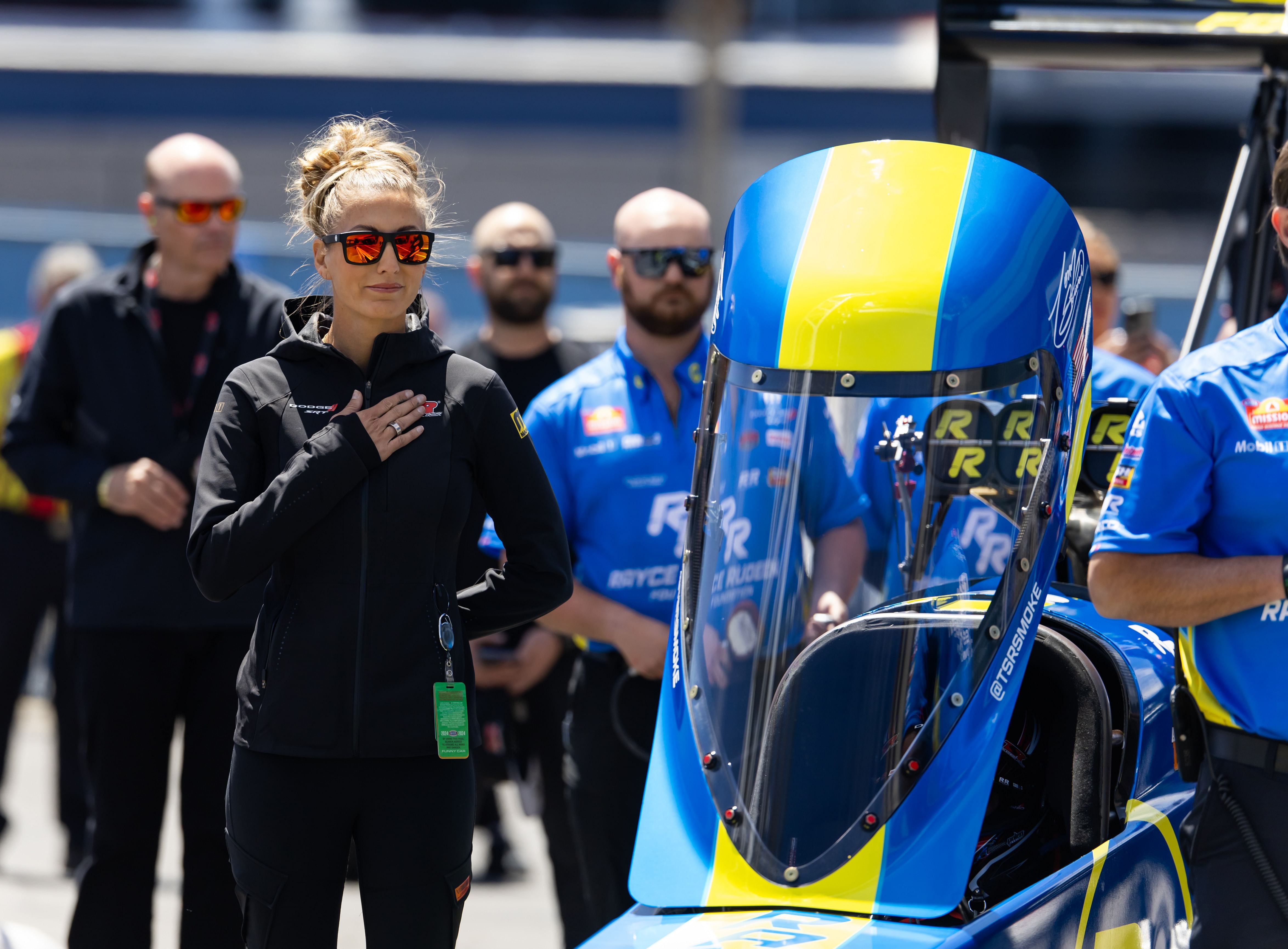 Leah Pruett stands alongside the dragster of husband Tony Stewart during the 4 Wide Nationals at The Strip at Las Vegas Motor Speedway - Source: Imagn