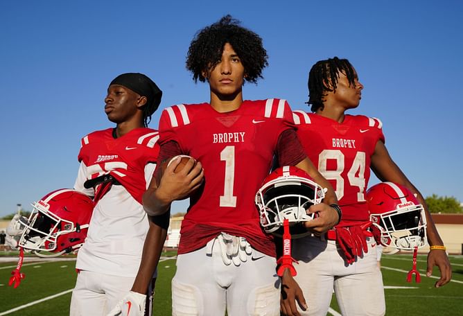 “Hopefully he plays like his pops”: CFB fans react as Pro Bowler Larry Fitzgerald’s son Devin sets an official visit to Michigan