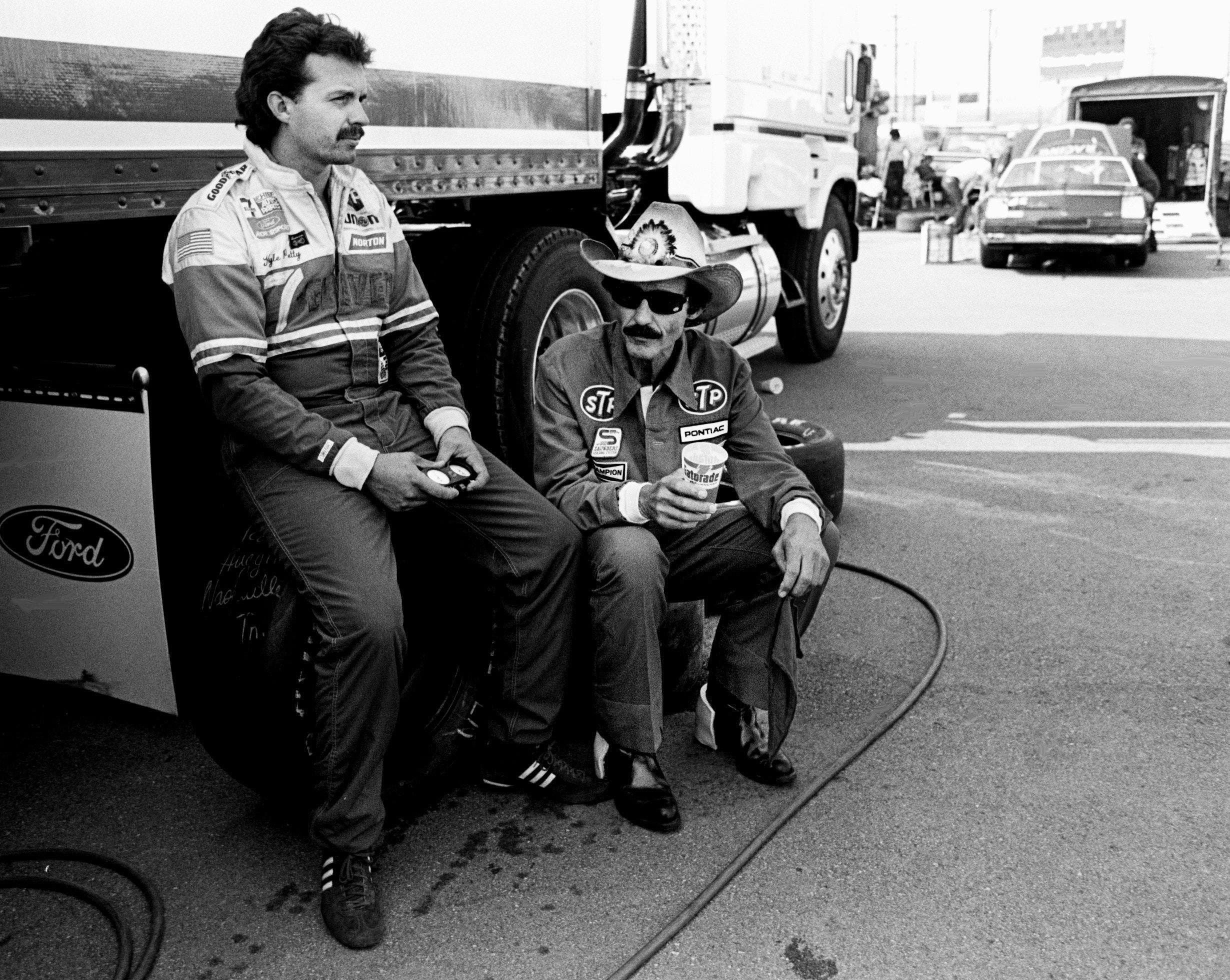 Kyle Petty (L) with his father Richard Petty during the Nashville Pepsi 420 on July 13, 1984.- Source: Imagn