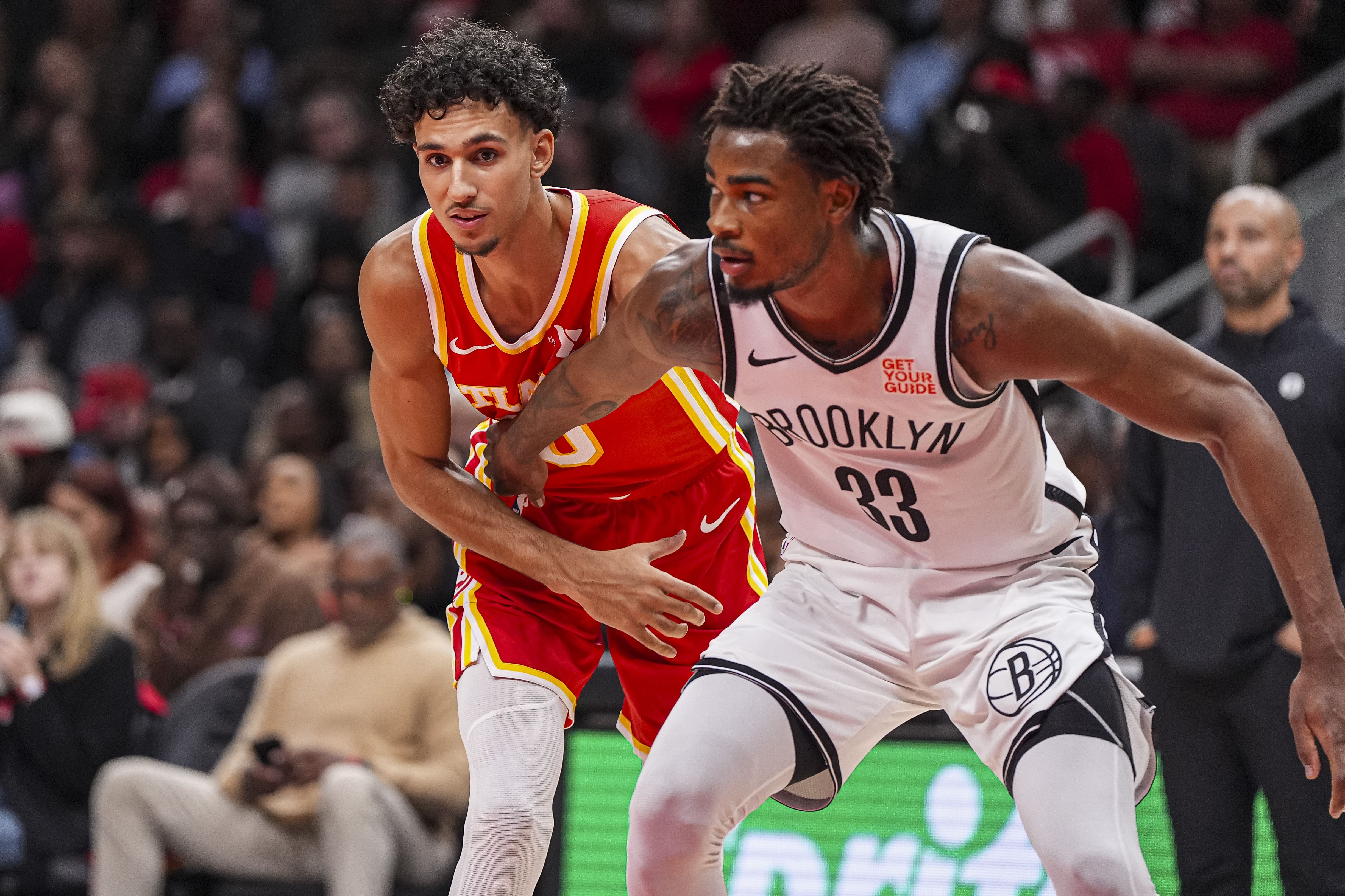 Atlanta Hawks forward Zaccharie Risacher tries to get position on Brooklyn Nets center Nic Claxton at State Farm Arena. Photo Credit: Imagn