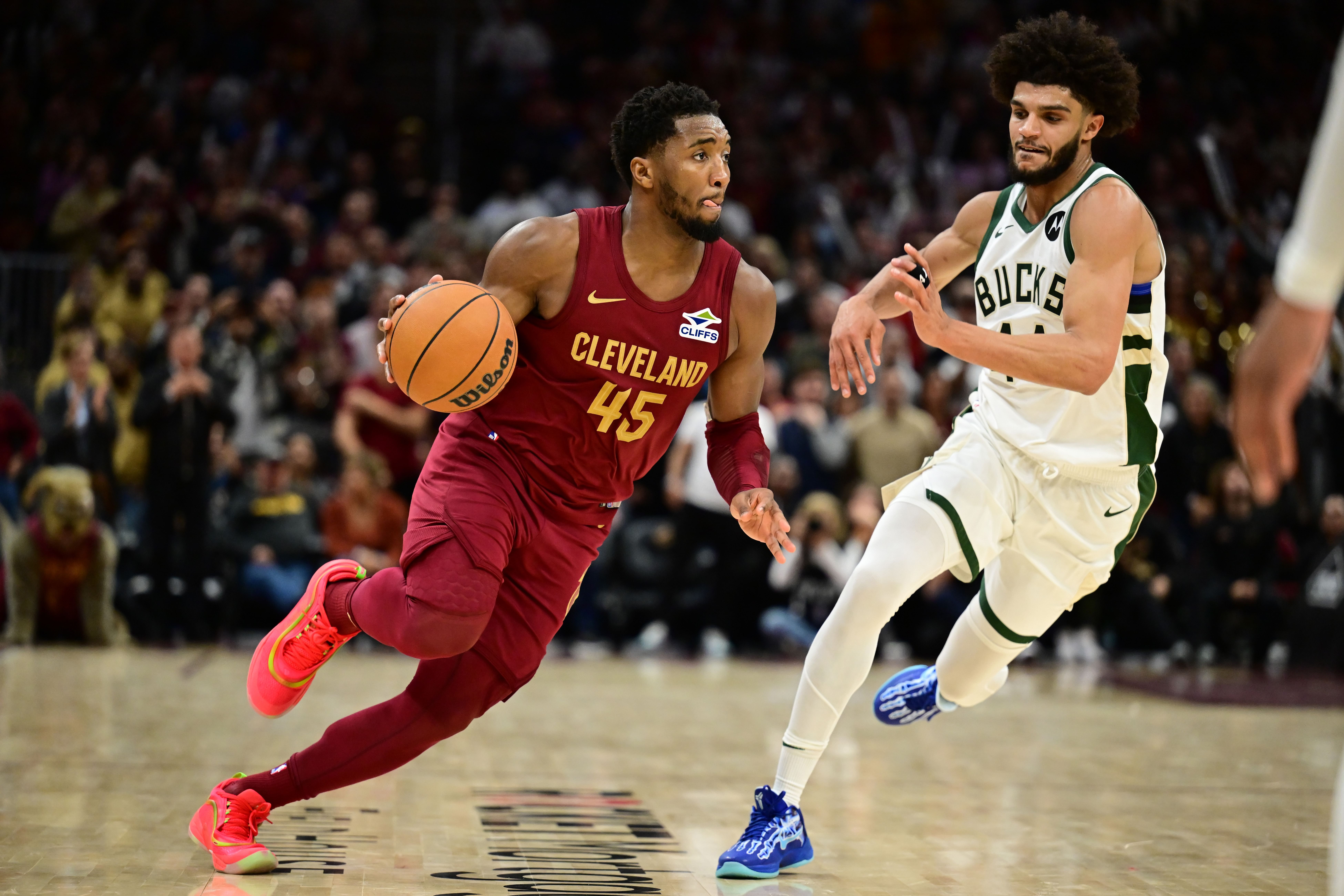 Cleveland Cavaliers guard Donovan Mitchell drives to the basket against Milwaukee Bucks guard Andre Jackson Jr. at Rocket Mortgage FieldHouse. Photo Credit: Imagn