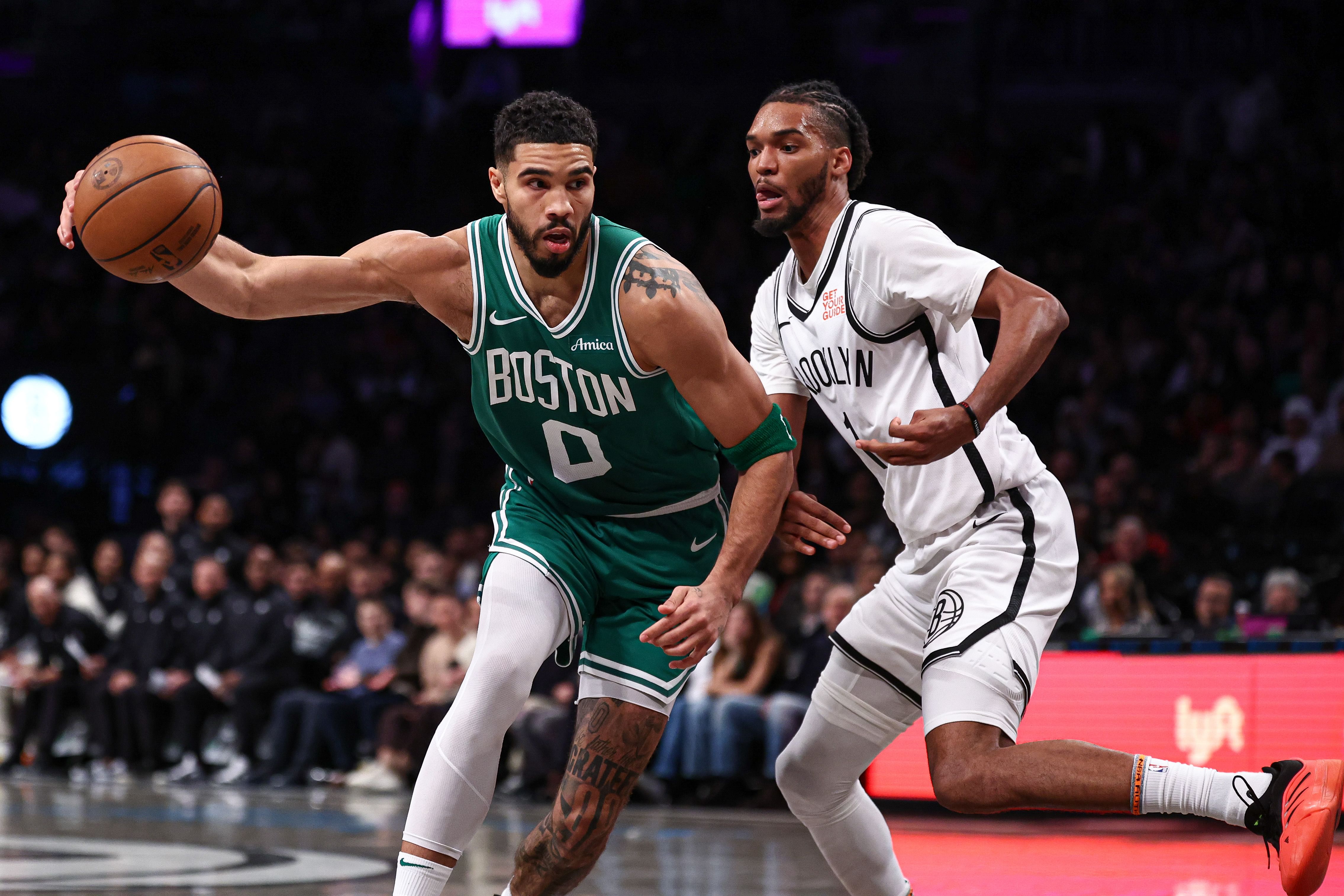 Boston Celtics forward Jayson Tatum loses control of the ball as Brooklyn Nets forward Ziaire Williams defends at Barclays Center. Photo Credit: Imagn