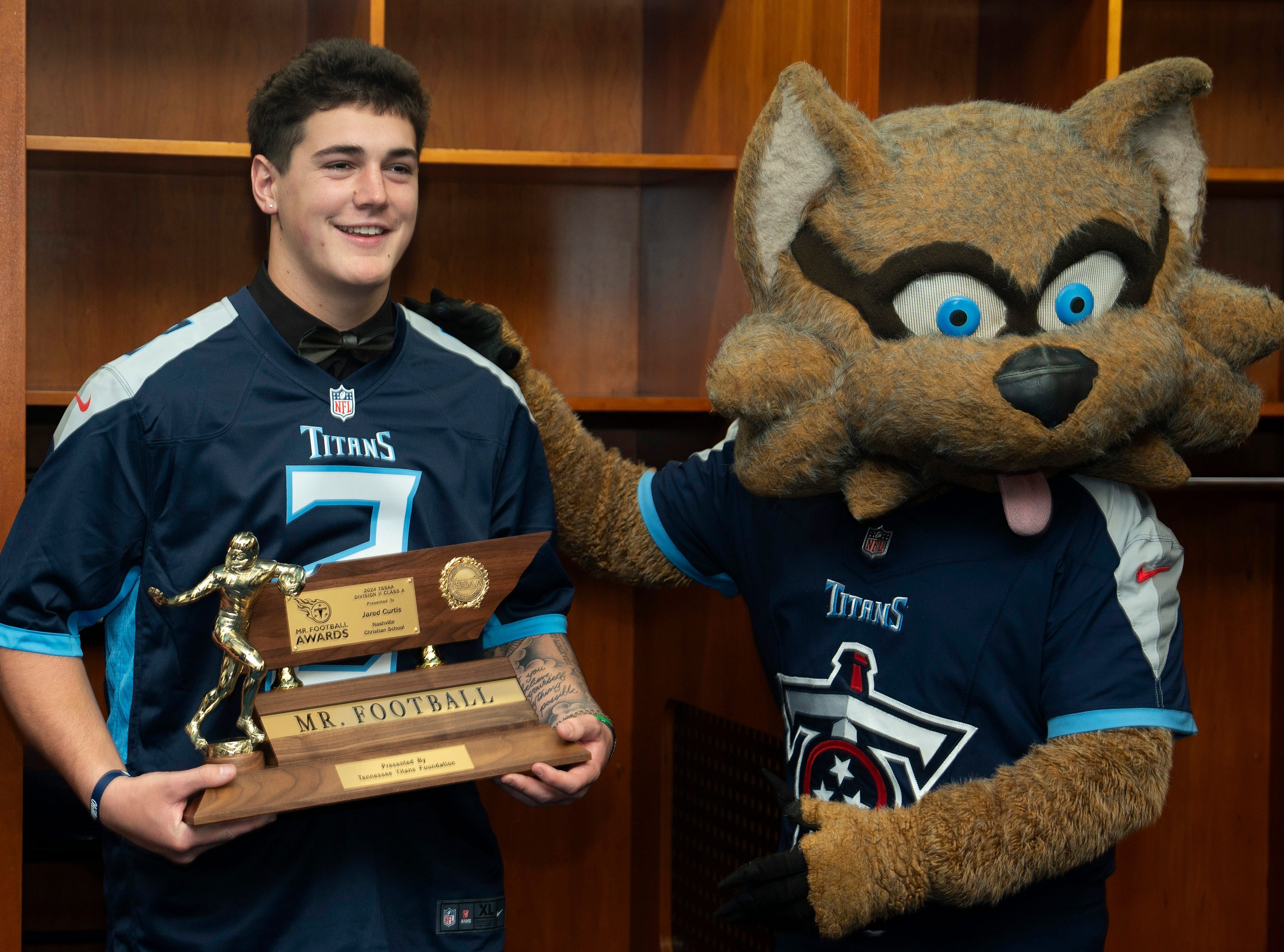 Division II - Class A 2024 Tennessee Titans Mr. Football Jared Curtis, Nashville Christian School, is photographed with T-Rac during the Titans Mr. Football Awards at Nissan Stadium in Nashville, Tenn., Tuesday, Dec. 10, 2024. - Source: Imagn