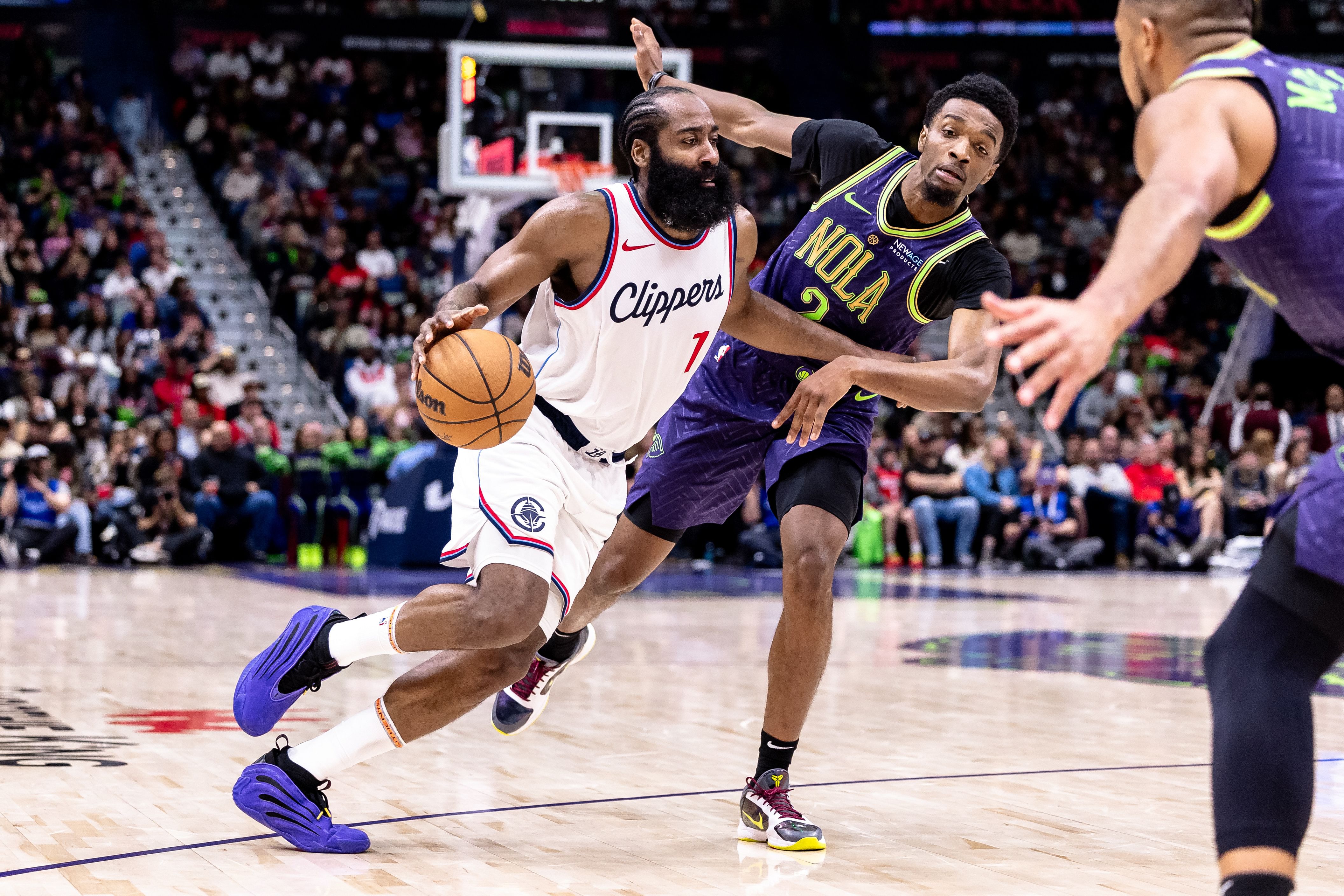 LA Clippers guard James Harden dribbles against New Orleans Pelicans forward Herbert Jones at the Smoothie King Center. Photo Credit: Imagn