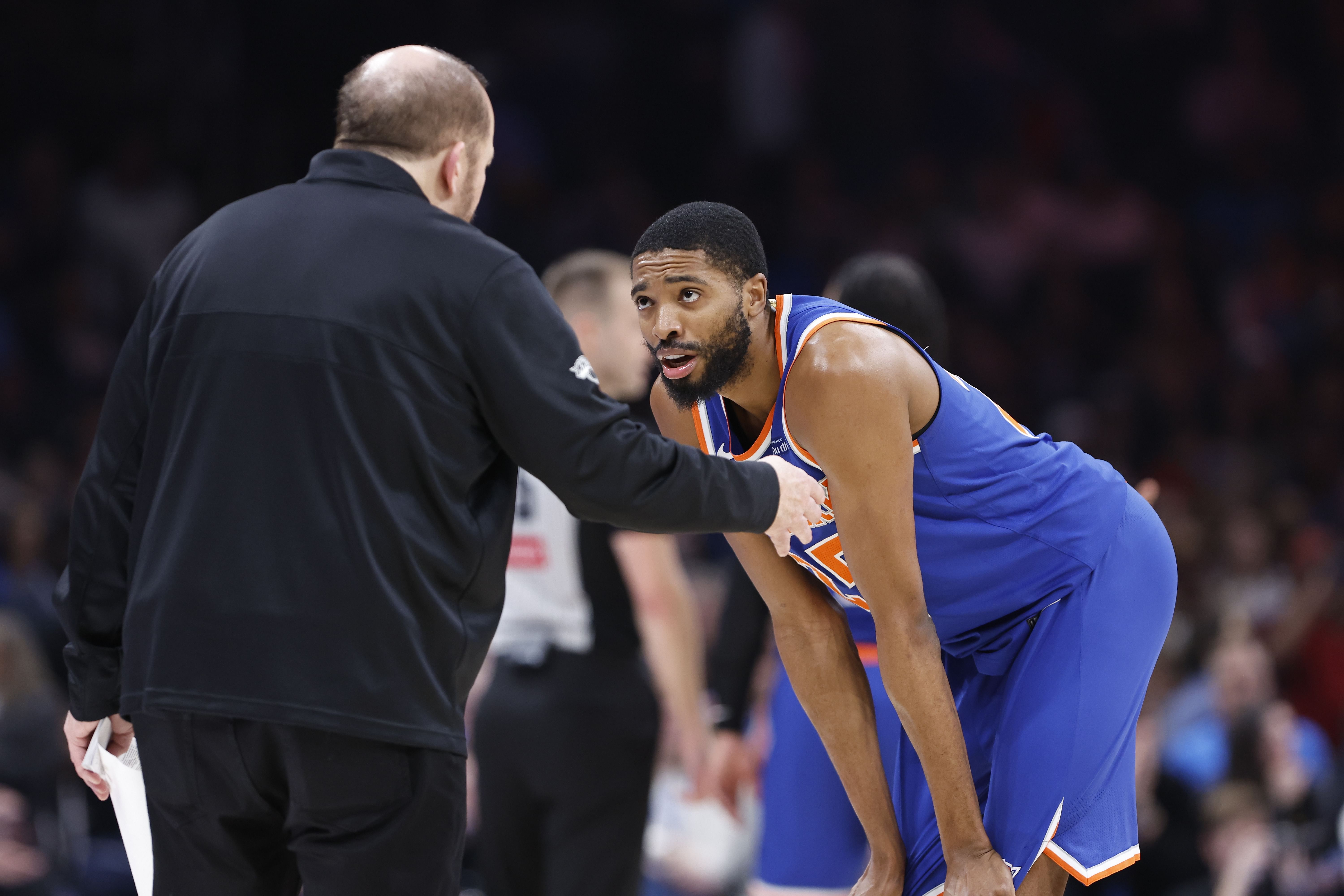 New York Knicks forward Mikal Bridges talks with head coach Tom Thibodeau during a break in play against the Oklahoma City Thunder during the second quarter at Paycom Center. Photo Credit: Imagn