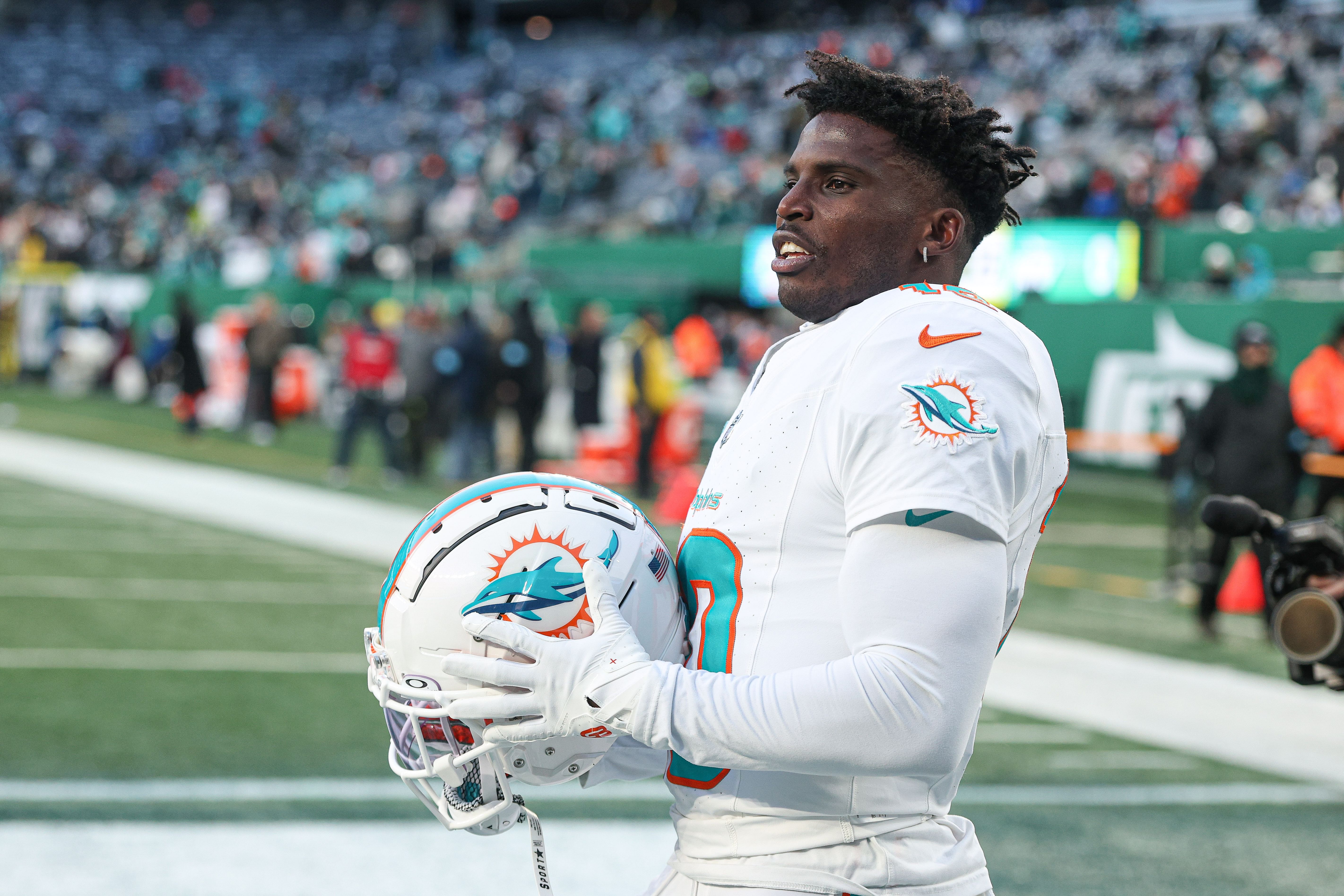 Jan 5, 2025; East Rutherford, New Jersey, USA; Miami Dolphins wide receiver Tyreek Hill (10) on the field before the game against the New York Jets at MetLife Stadium. Mandatory Credit: Vincent Carchietta-Imagn Images - Source: Imagn