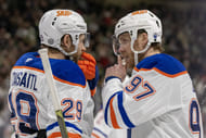 Edmonton Oilers forwards Leon Draisaitl (29) and Connor McDavid (97) talk during an NHL game. (Credits: IMAGN)