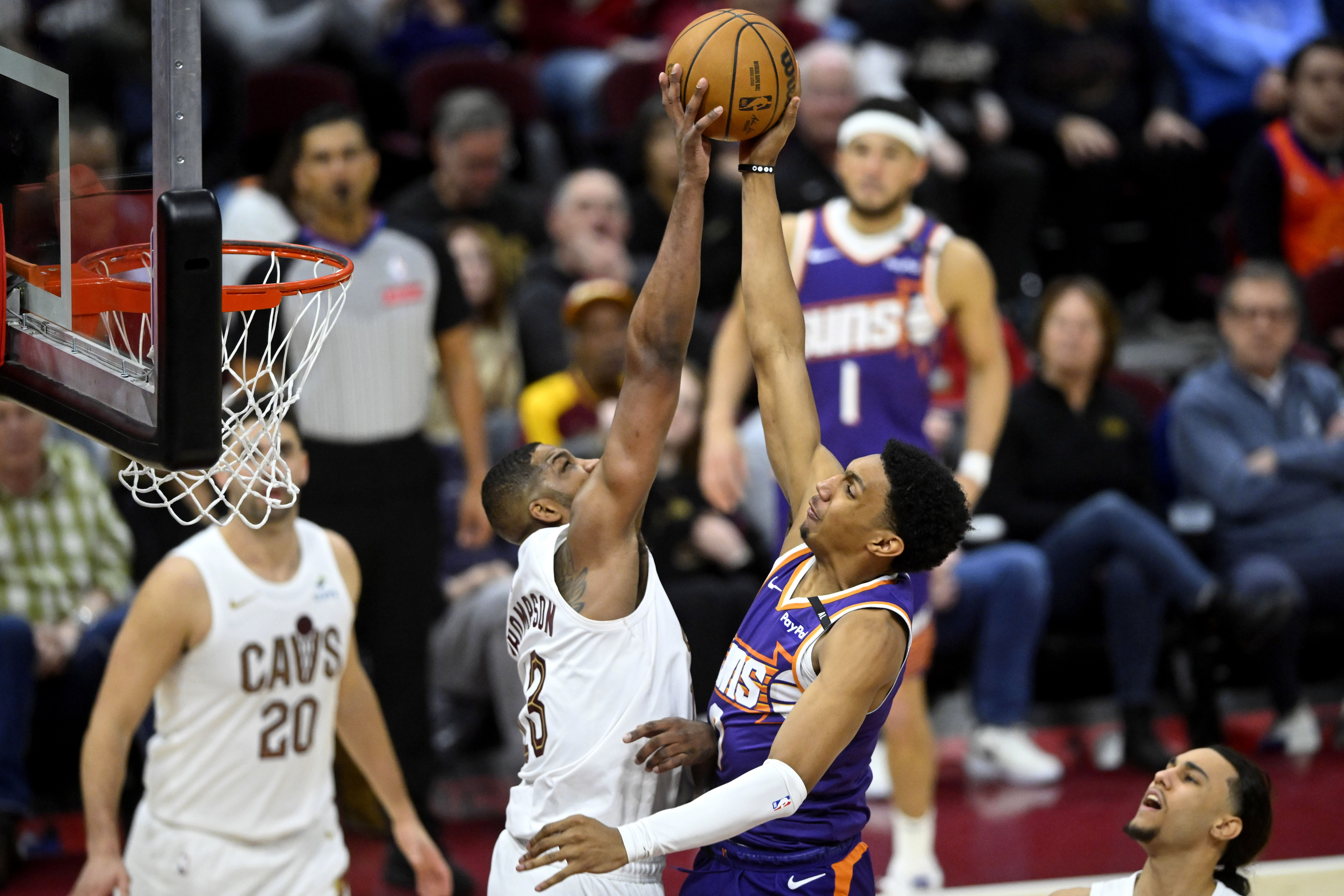 Jan 20, 2025; Cleveland, Ohio, USA; Cleveland Cavaliers center Tristan Thompson (13) blocks a shot by Phoenix Suns forward Ryan Dunn (0) in the fourth quarter at Rocket Mortgage FieldHouse. Mandatory Credit: David Richard-Imagn Images - Source: Imagn