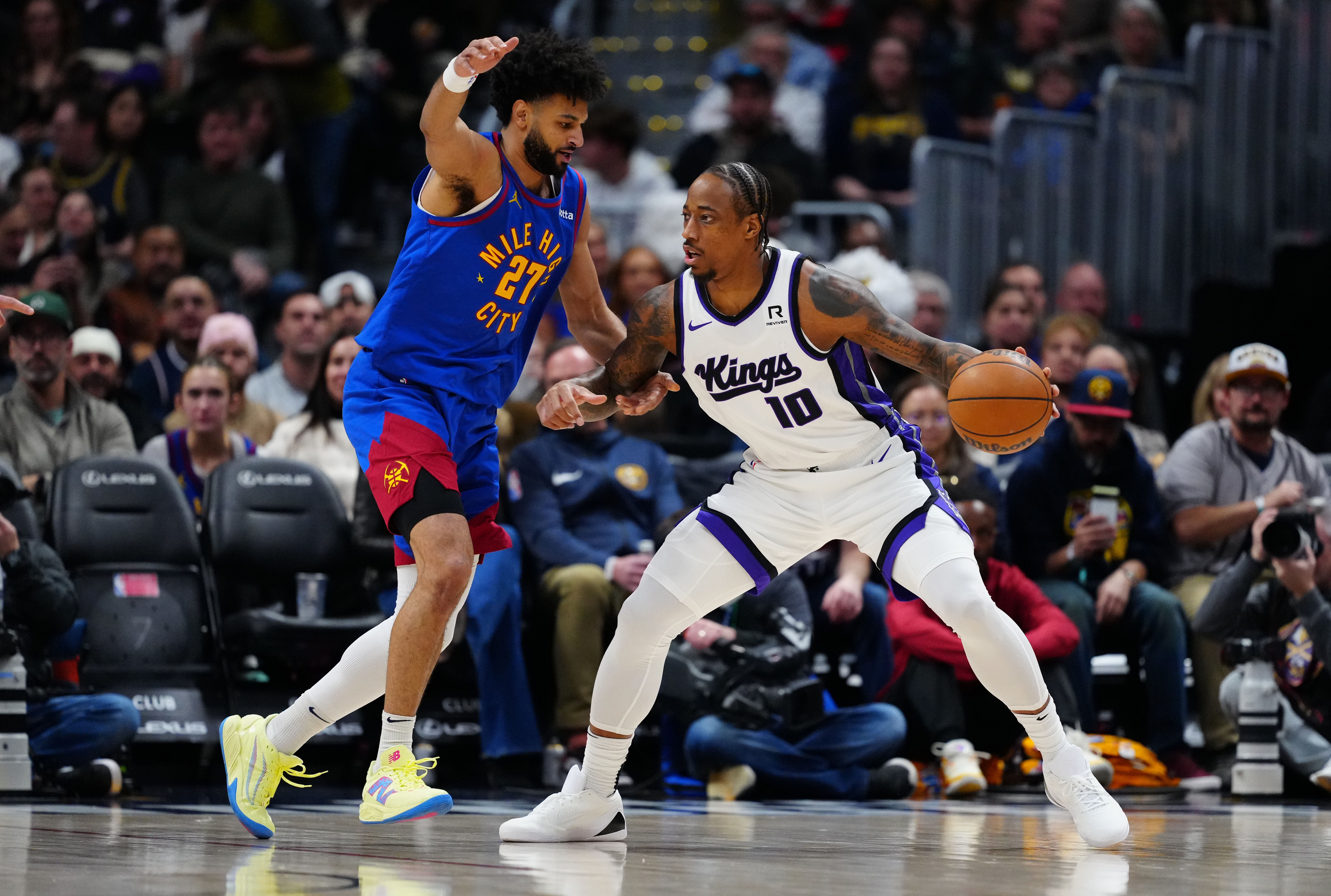 Denver Nuggets guard Jamal Murray defends on Sacramento Kings forward DeMar DeRozan at Ball Arena. Photo Credit: Imagn