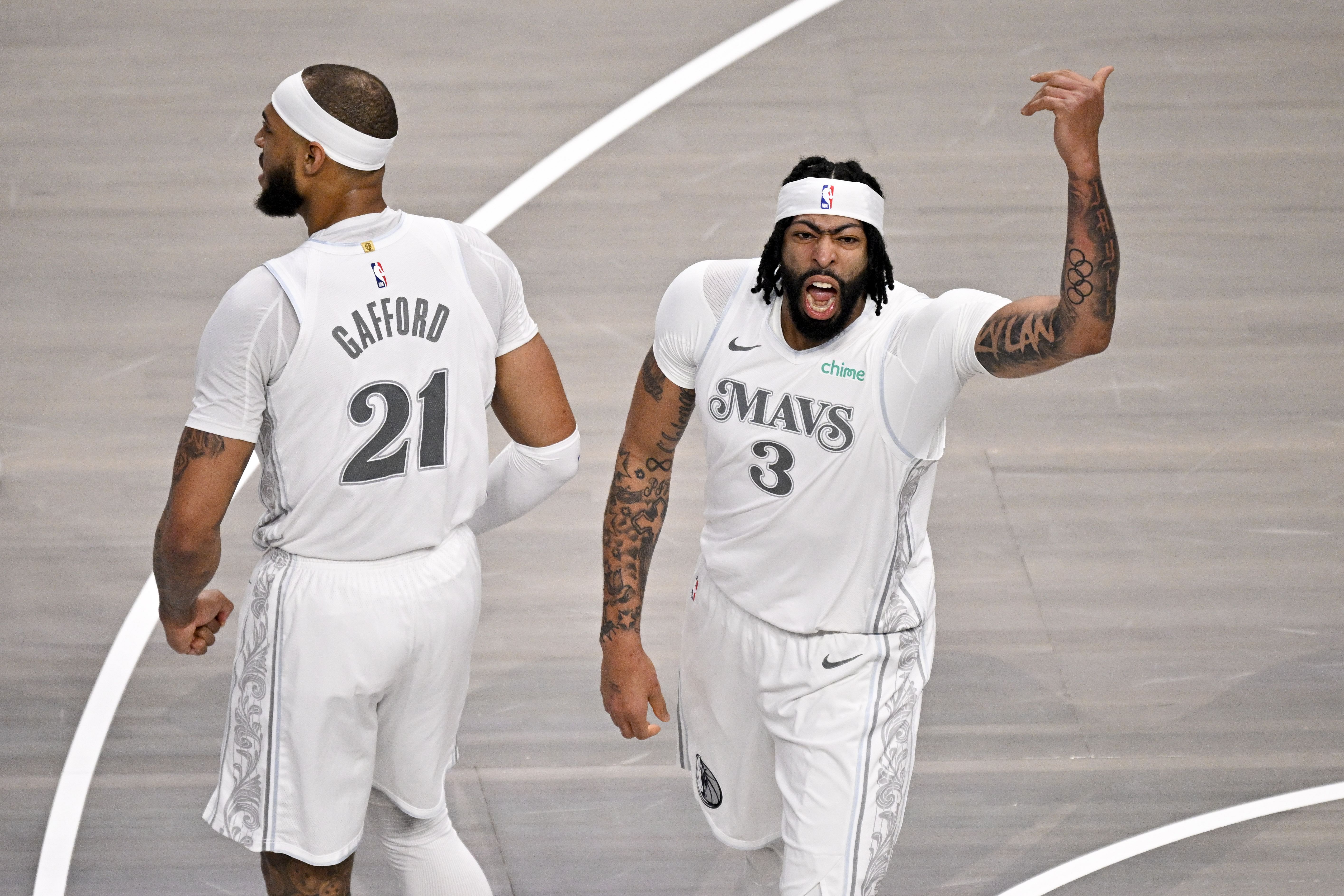 Feb 8, 2025; Dallas, Texas, USA; Dallas Mavericks center Daniel Gafford (21) and forward Anthony Davis (3) celebrate after Davis dunks the ball against the Houston Rockets during the first quarter at American Airlines Center. Mandatory Credit: Jerome Miron-Imagn Images - Source: Imagn