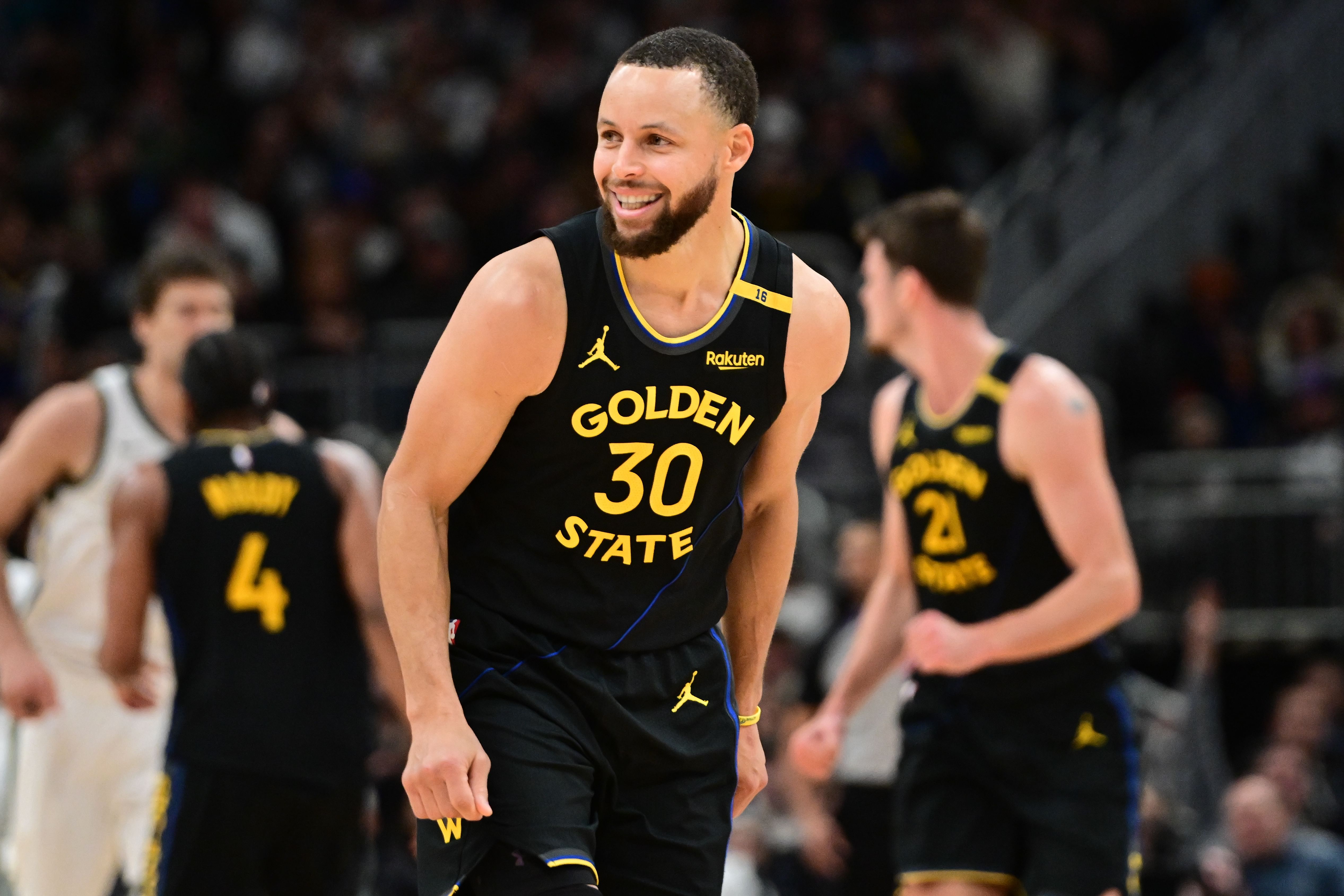 Golden State Warriors guard Stephen Curry reacts against the Milwaukee Bucks at Fiserv Forum. Photo Credit: Imagn