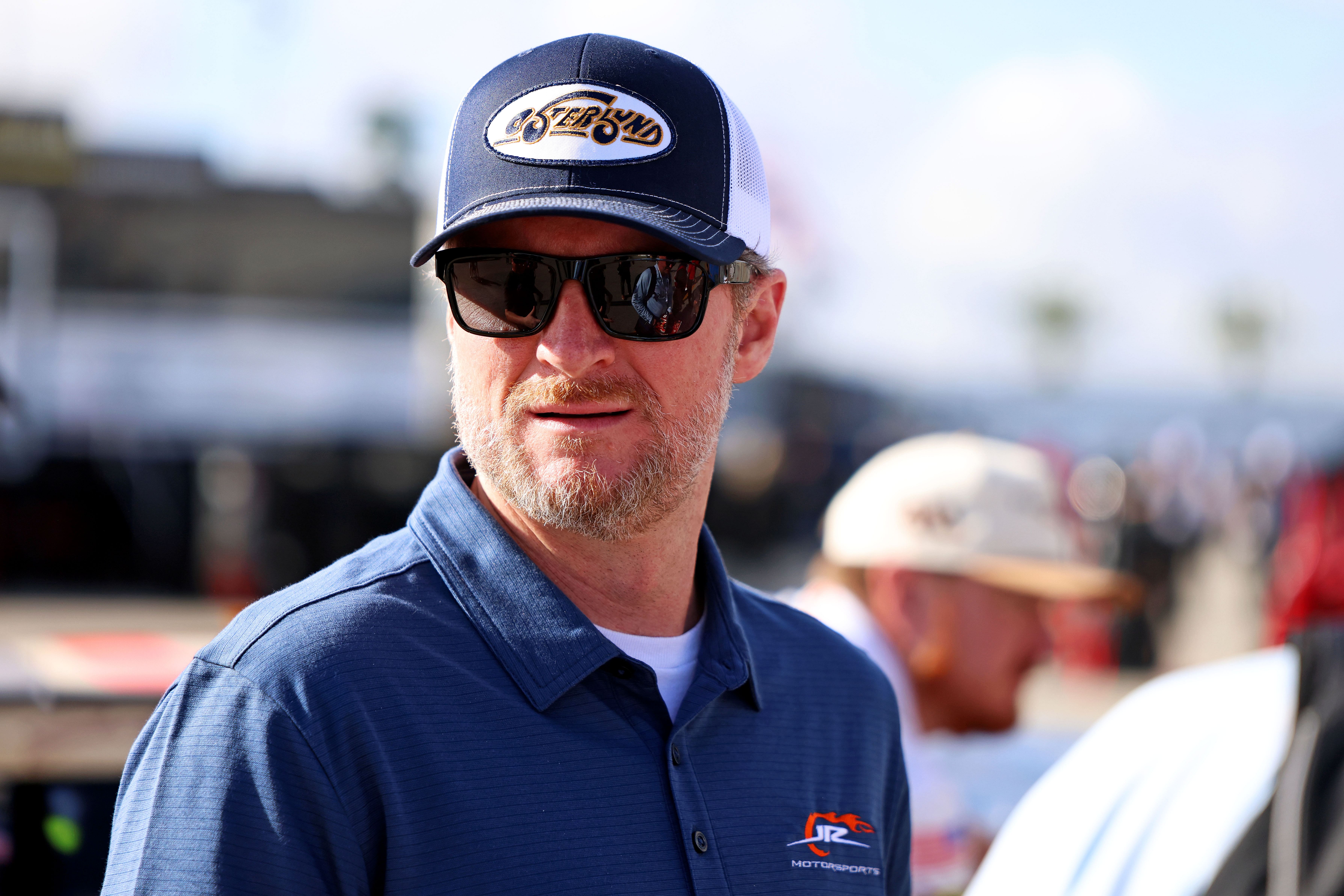 Feb 12, 2025; Daytona Beach, Florida, USA; NASCAR team owner Dale Earnhardt Jr. looks on during practice for the Daytona 500 at Daytona International Speedway. Mandatory Credit: Peter Casey-Imagn Images - Source: Imagn