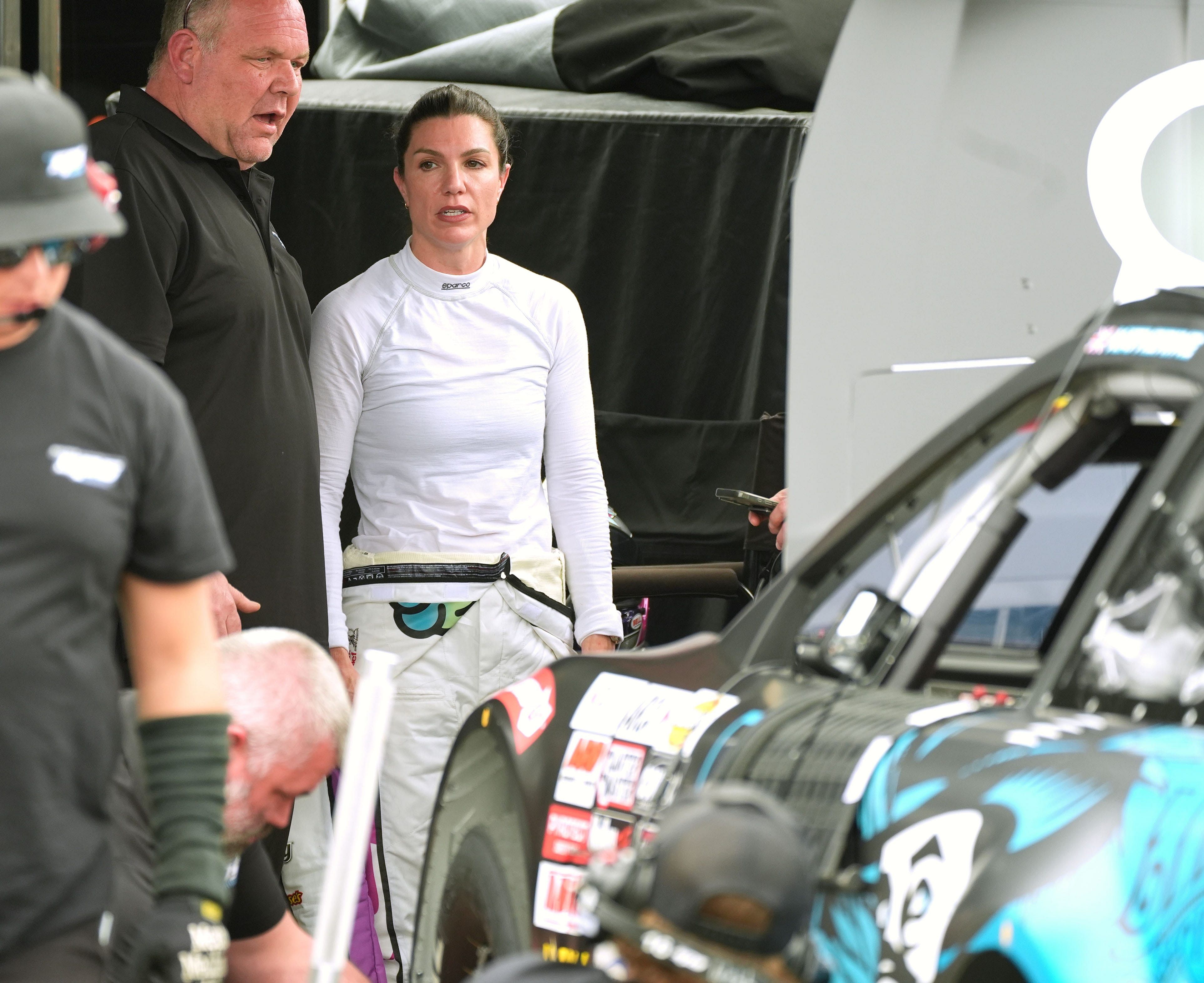 Katherine Legge talks with the crew as they work on the no. 23 Chevrolet following ARCA practice - Source: Imagn