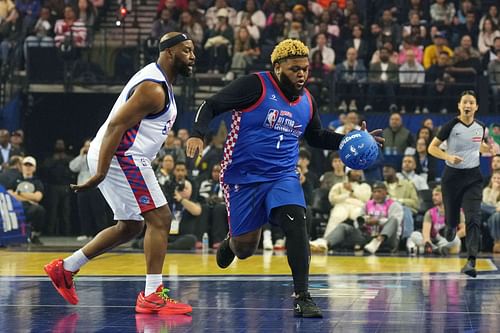 Druski of Team Rice dribbles the ball against Baron Davis of Team Bonds during the celebrity game at Oakland Arena. Photo Credits Imagn