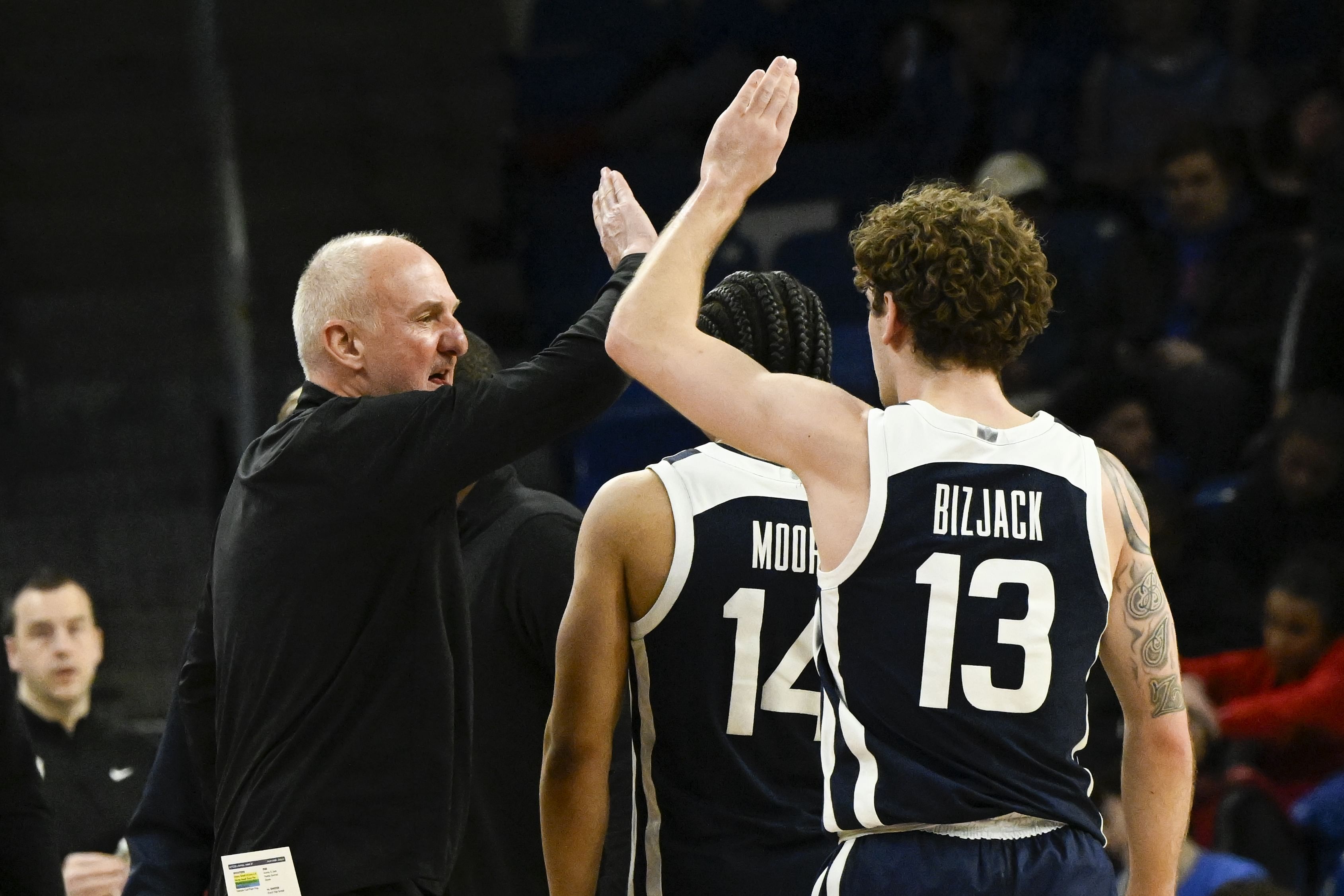 Butler Bulldogs coach Thad Matta high fives Butler Bulldogs guard Finley Bizjack (#13) during the second half of their NCAA basketball game against the DePaul Blue Demons at Wintrust Arena. Photo: Imagn