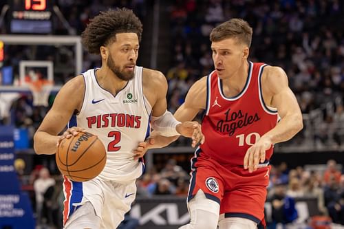 LA Clippers guard Bogdan Bogdanovic defends against Detroit Pistons guard Cade Cunningham at Little Caesars Arena. Photo Credit: Imagn