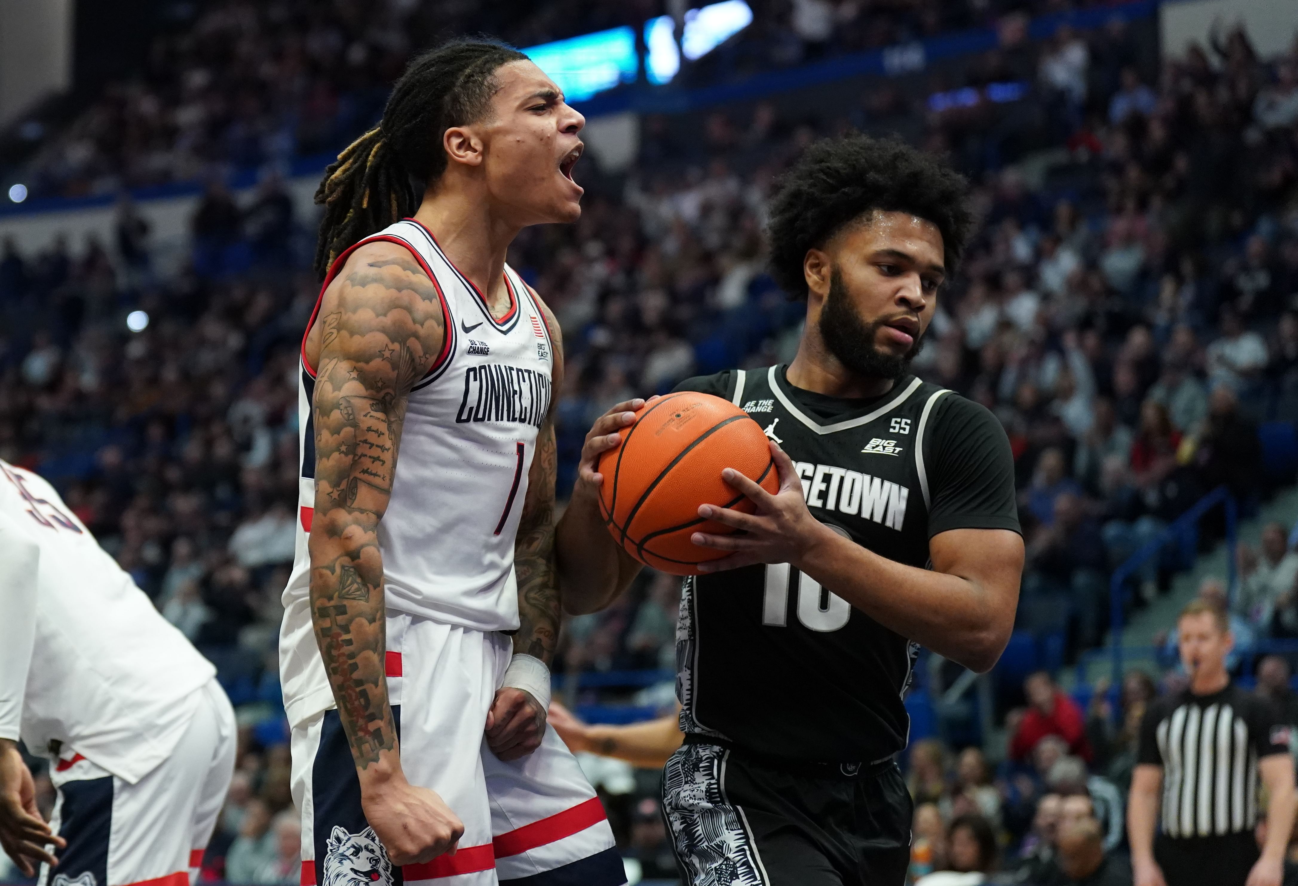 UConn Huskies guard Solo Ball (1) reacts after scoring a basket against the Georgetown Hoyas in the first half of their NCAA game at XL Center. Photo: Imagn