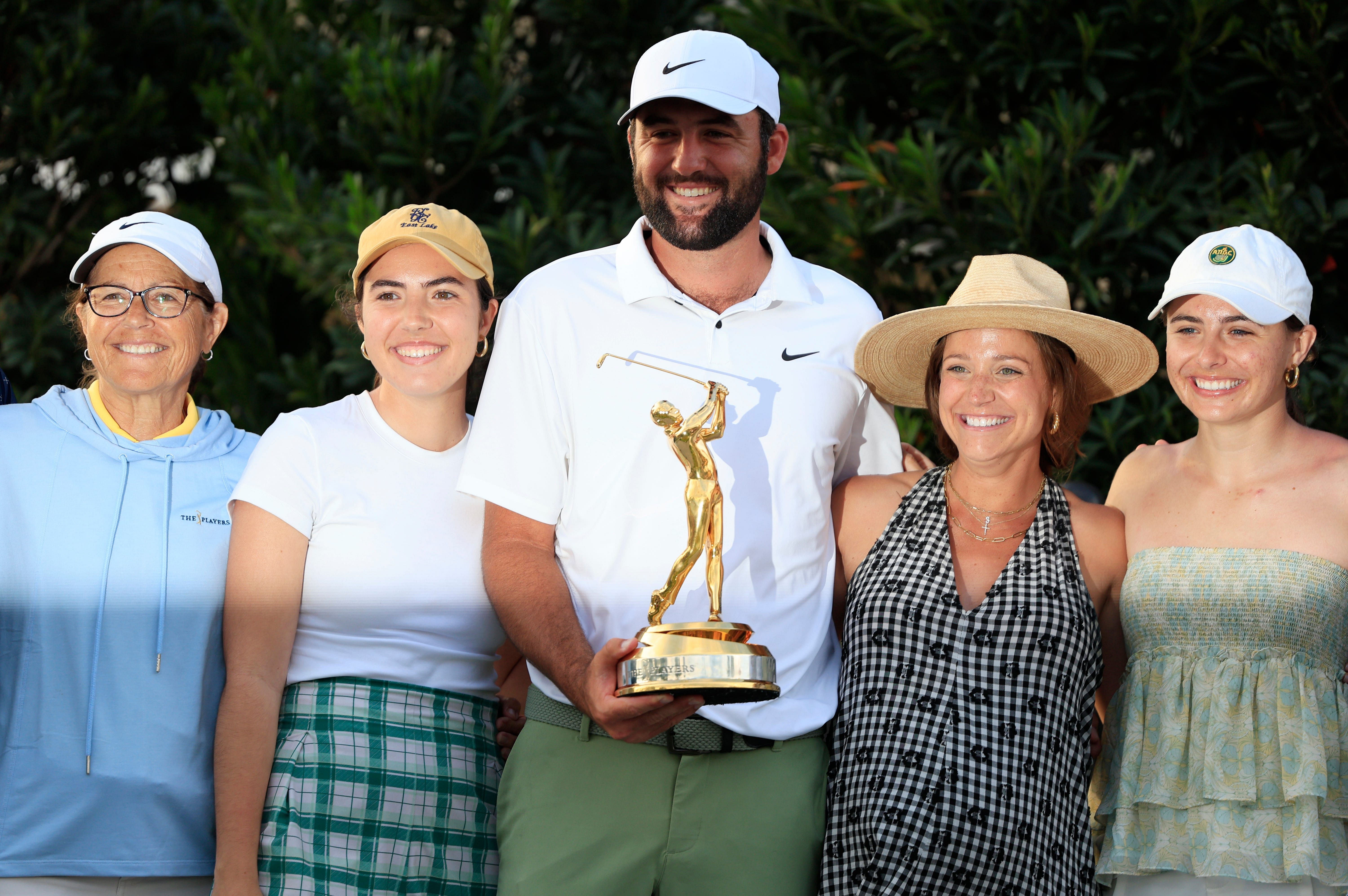 Scottie Scheffler poses with family and friends after Players Championship 2024 win (Image Source: Imagn)