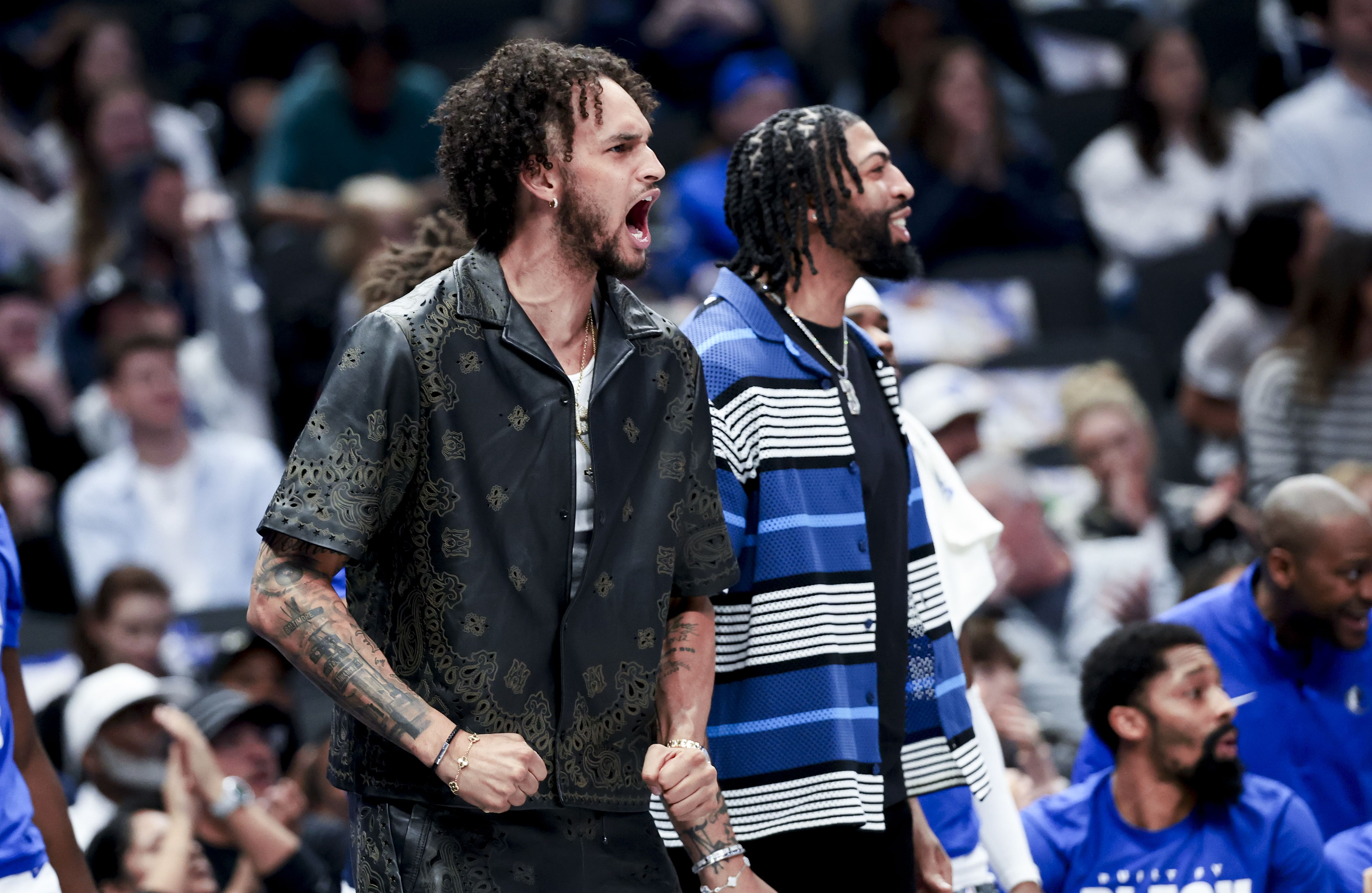 Feb 27, 2025; Dallas, Texas, USA; Dallas Mavericks center Dereck Lively II (2) and Dallas Mavericks forward Anthony Davis (3) react on the bench against the Charlotte Hornets during the first half at American Airlines Center. Mandatory Credit: Kevin Jairaj-Imagn Images - Source: Imagn