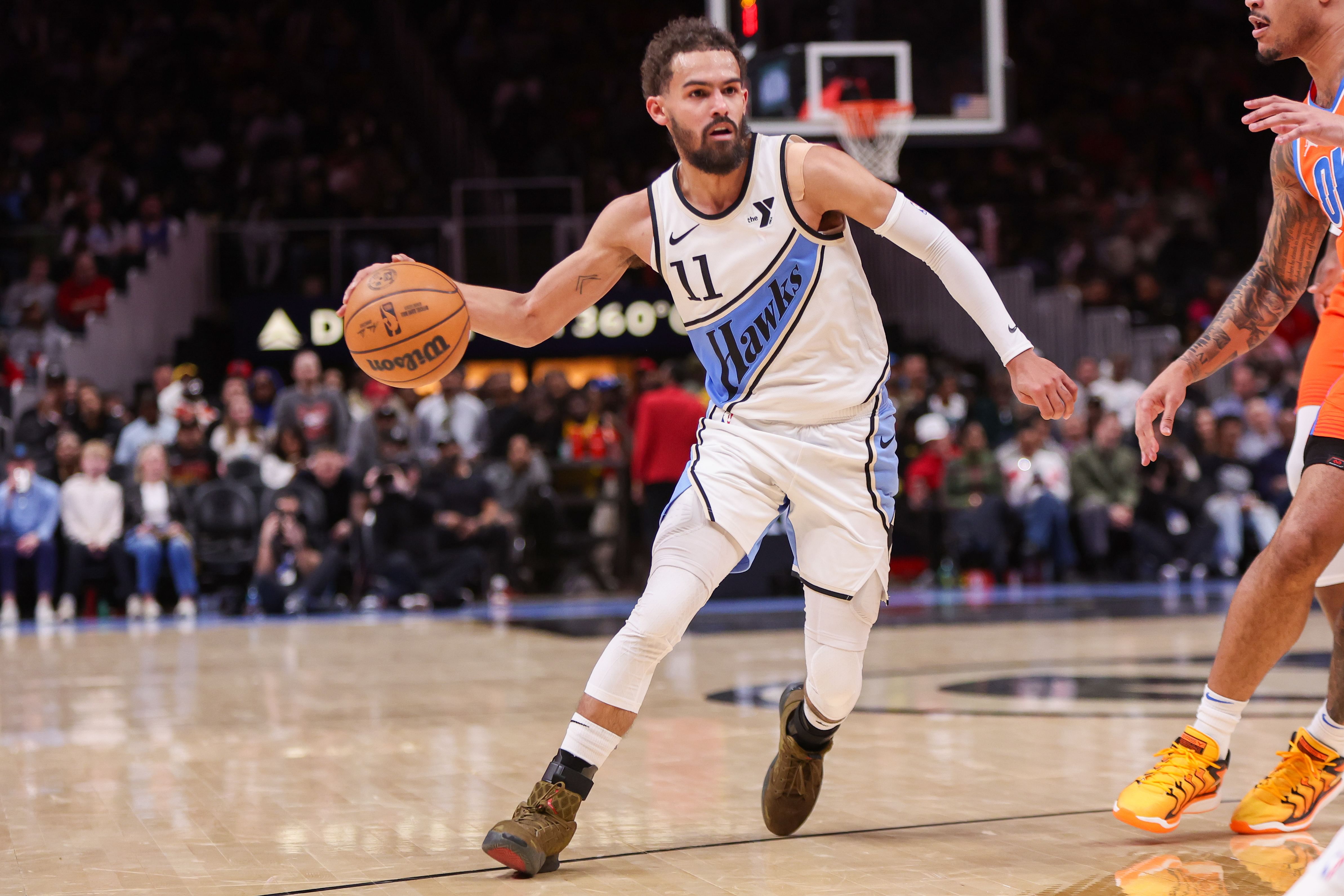 Feb 28, 2025; Atlanta, Georgia, USA; Atlanta Hawks guard Trae Young (11) drives to the basket against the Oklahoma City Thunder in the third quarter at State Farm Arena. Mandatory Credit: Brett Davis-Imagn Images - Source: Imagn