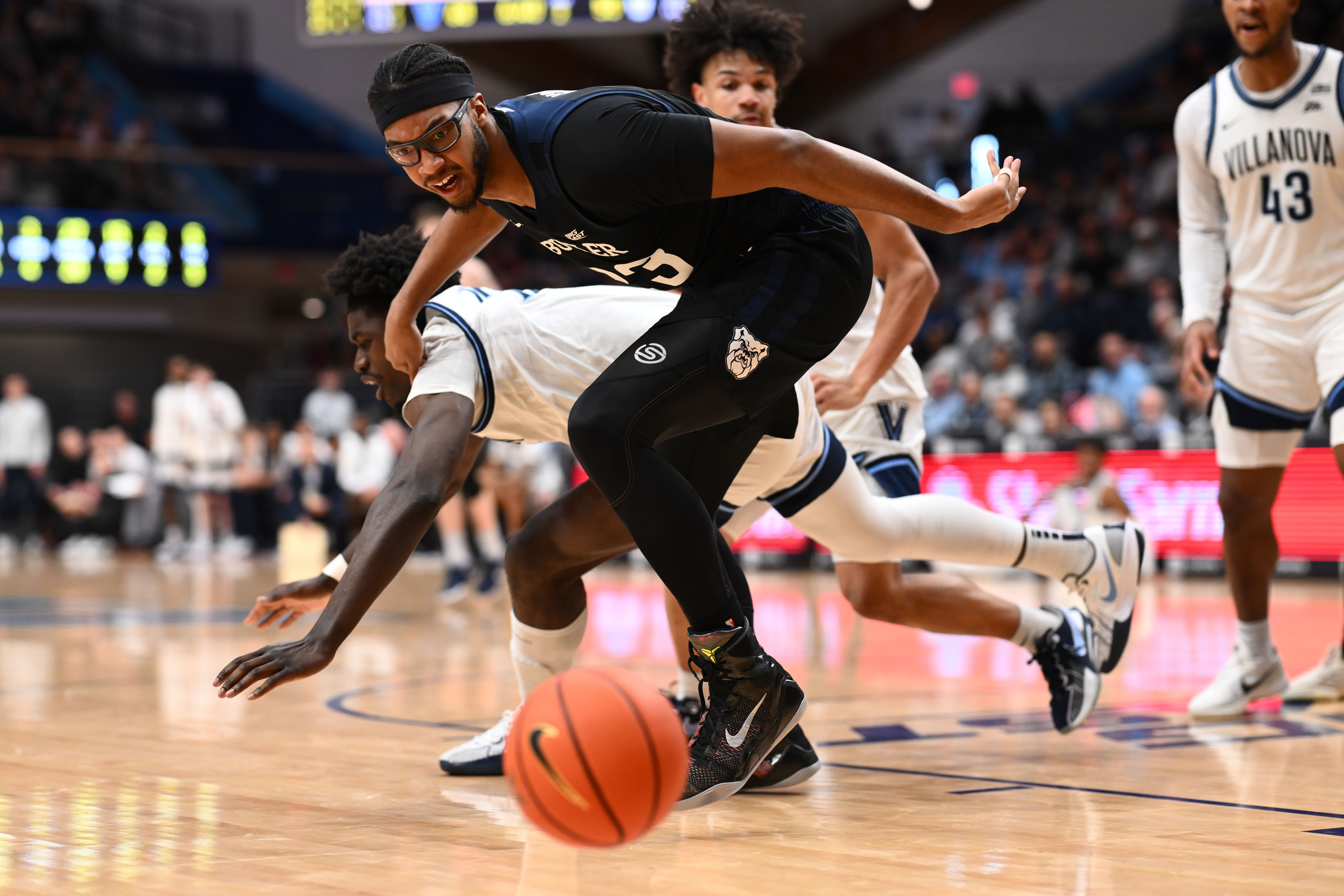 Butler Bulldogs center Andre Screen (#23) battles for a loose ball against Villanova Wildcats forward Enoch Boakye (13) in the second half of their NCAA basketball game at William B. Finneran Pavilion on March 1, 2025. Photo: Imagn