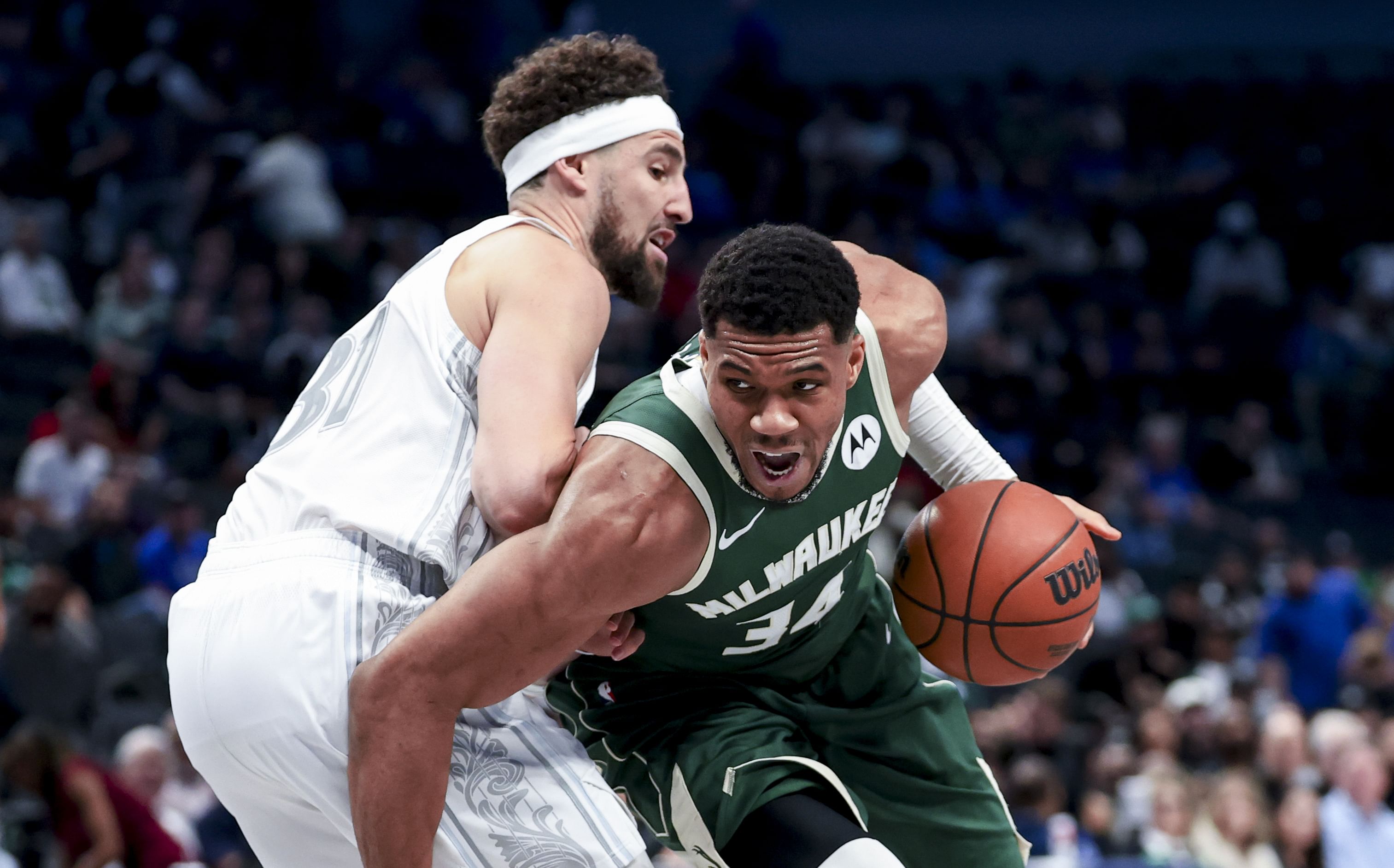 Mar 1, 2025; Dallas, Texas, USA; Milwaukee Bucks forward Giannis Antetokounmpo (34) drives to the basket past Dallas Mavericks guard Klay Thompson (31) during the second half at American Airlines Center. Mandatory Credit: Kevin Jairaj-Imagn Images - Source: Imagn