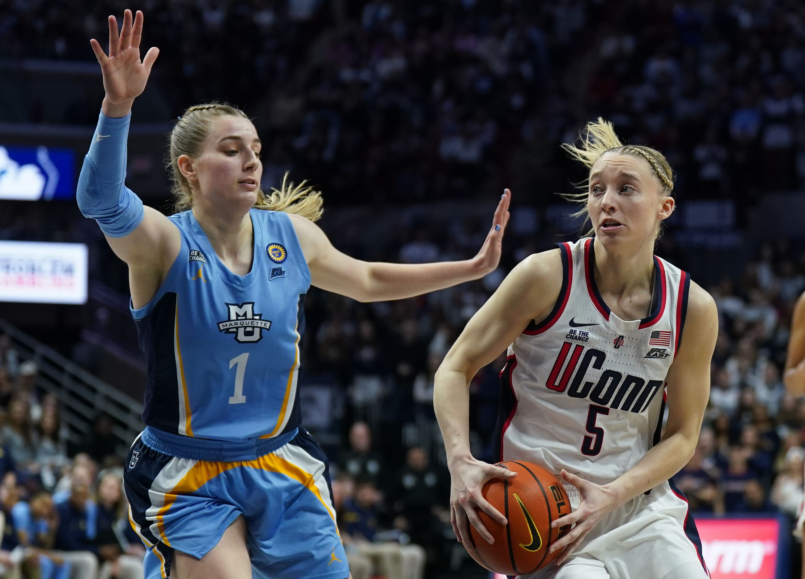 UConn Huskies guard Paige Bueckers (#5) looks for an opening past Marquette Golden Eagles guard Lee Volker (1) in the second half at Harry A. Gampel Pavilion. Photo: Imagn