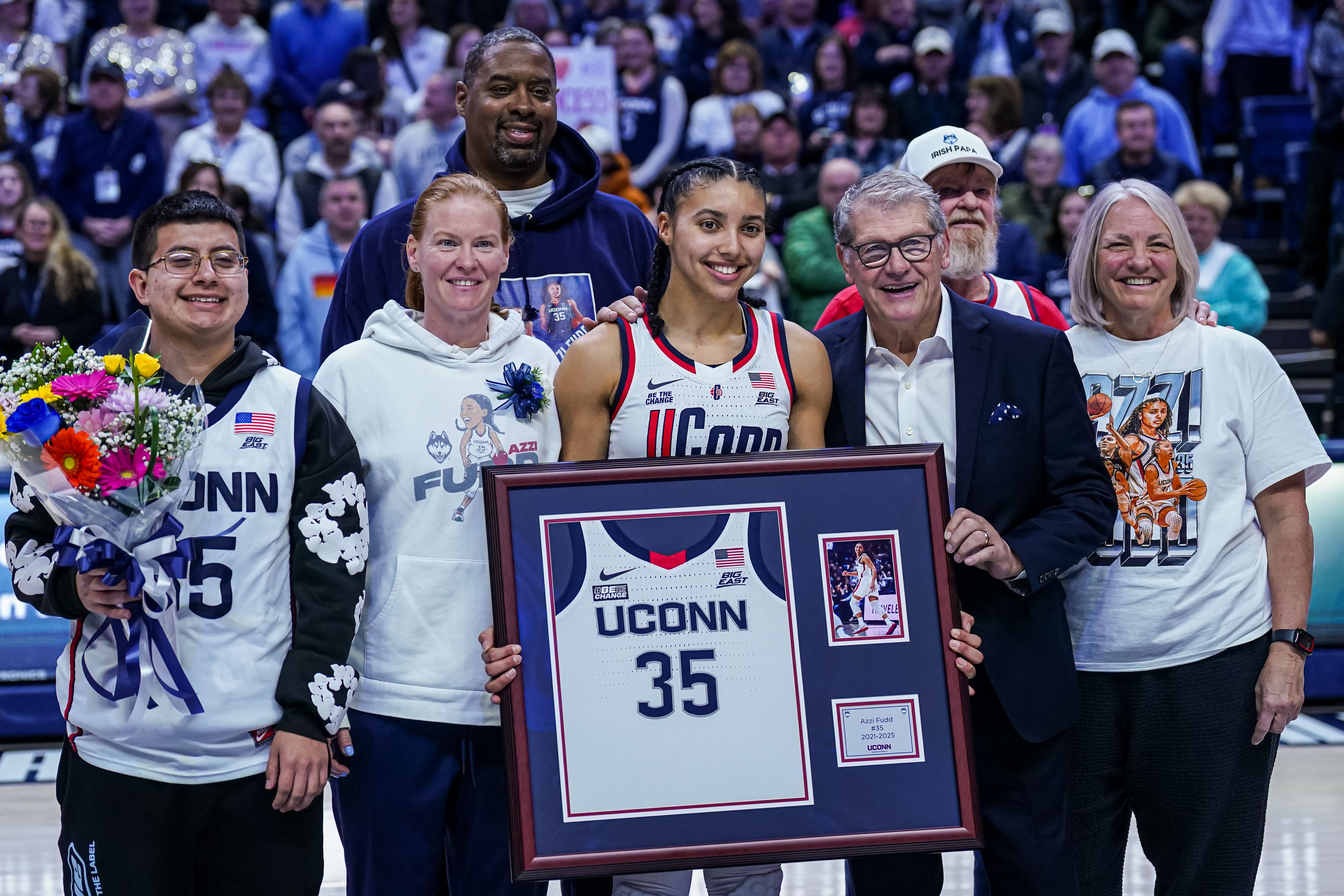 UConn Huskies guard Azzi Fudd (#35) is recognized during senior night alongside head coach Geno Auriemma and her family after the game against Marquette. Photo: Imagn