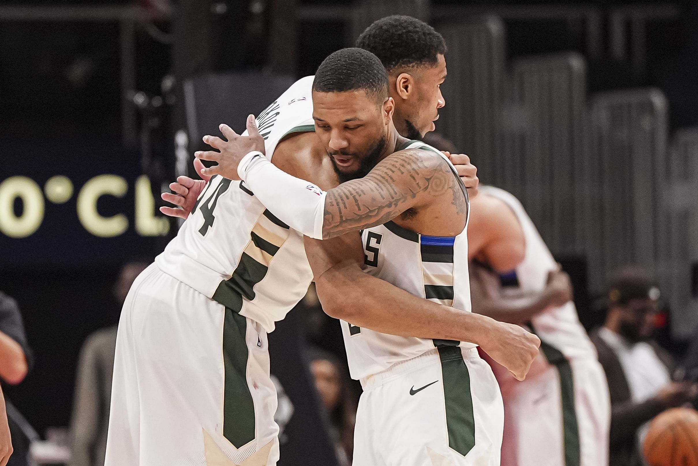 Mar 4, 2025; Atlanta, Georgia, USA; Milwaukee Bucks forward Giannis Antetokounmpo (34) and guard Damian Lillard (0) react after defeating the Atlanta Hawks at State Farm Arena. Mandatory Credit: Dale Zanine-Imagn Images - Source: Imagn