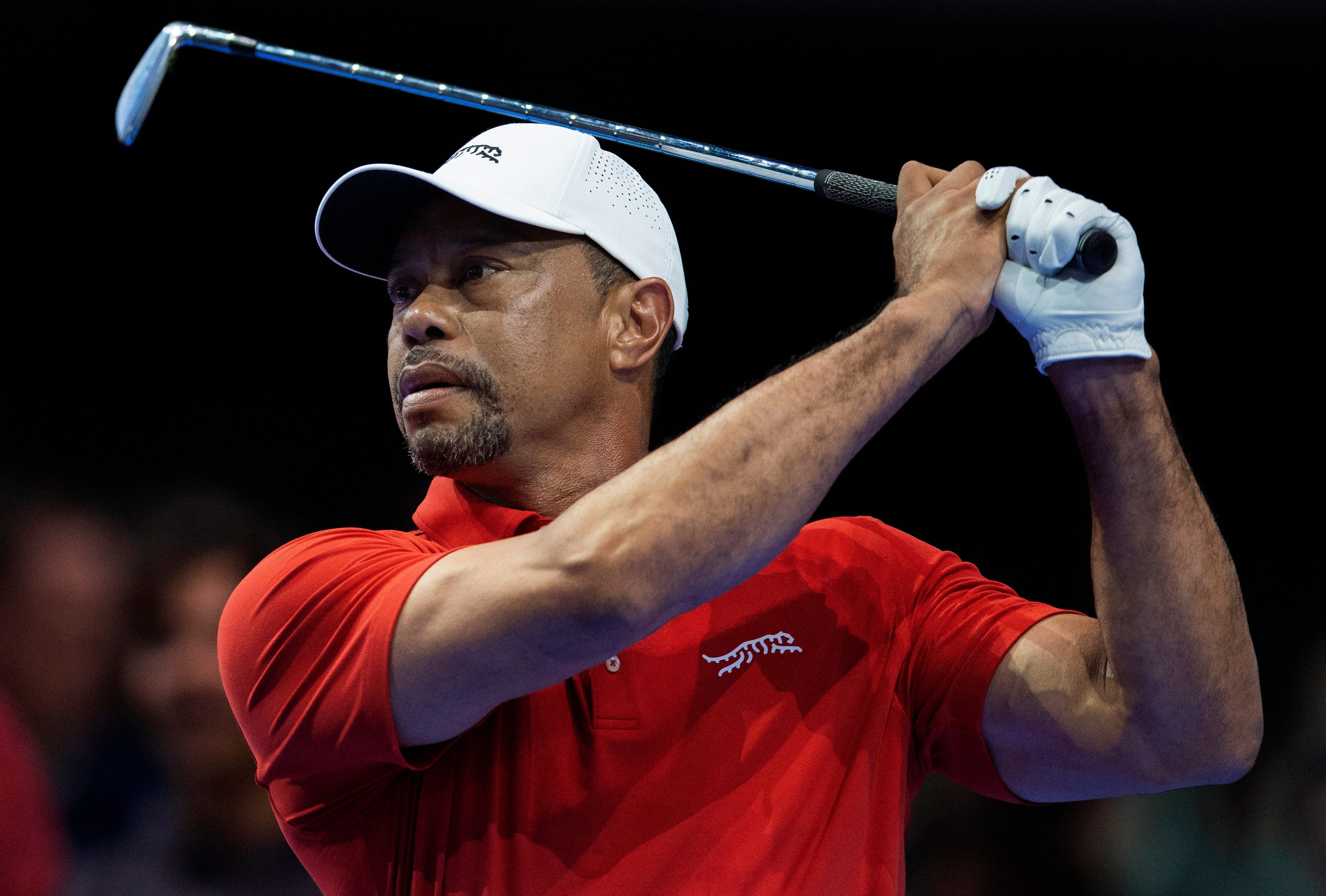 Tiger Woods of Jupiter Links GC tees off during a TGL match [Image via Imagn]