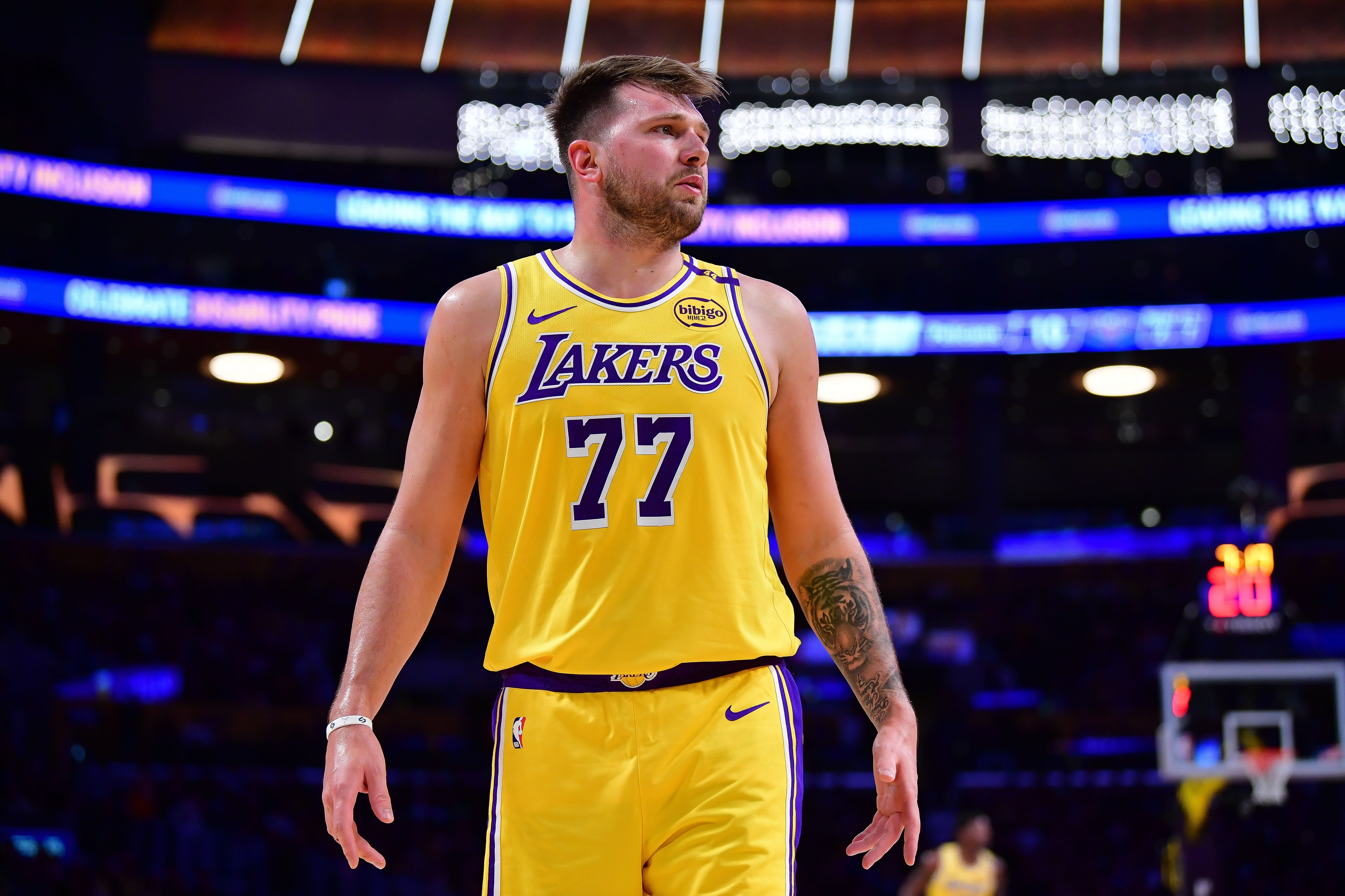 Mar 4, 2025; Los Angeles, California, USA; Los Angeles Lakers guard Luka Doncic (77) reacts during the first half at Crypto.com Arena. Mandatory Credit: Gary A. Vasquez-Imagn Images - Source: Imagn