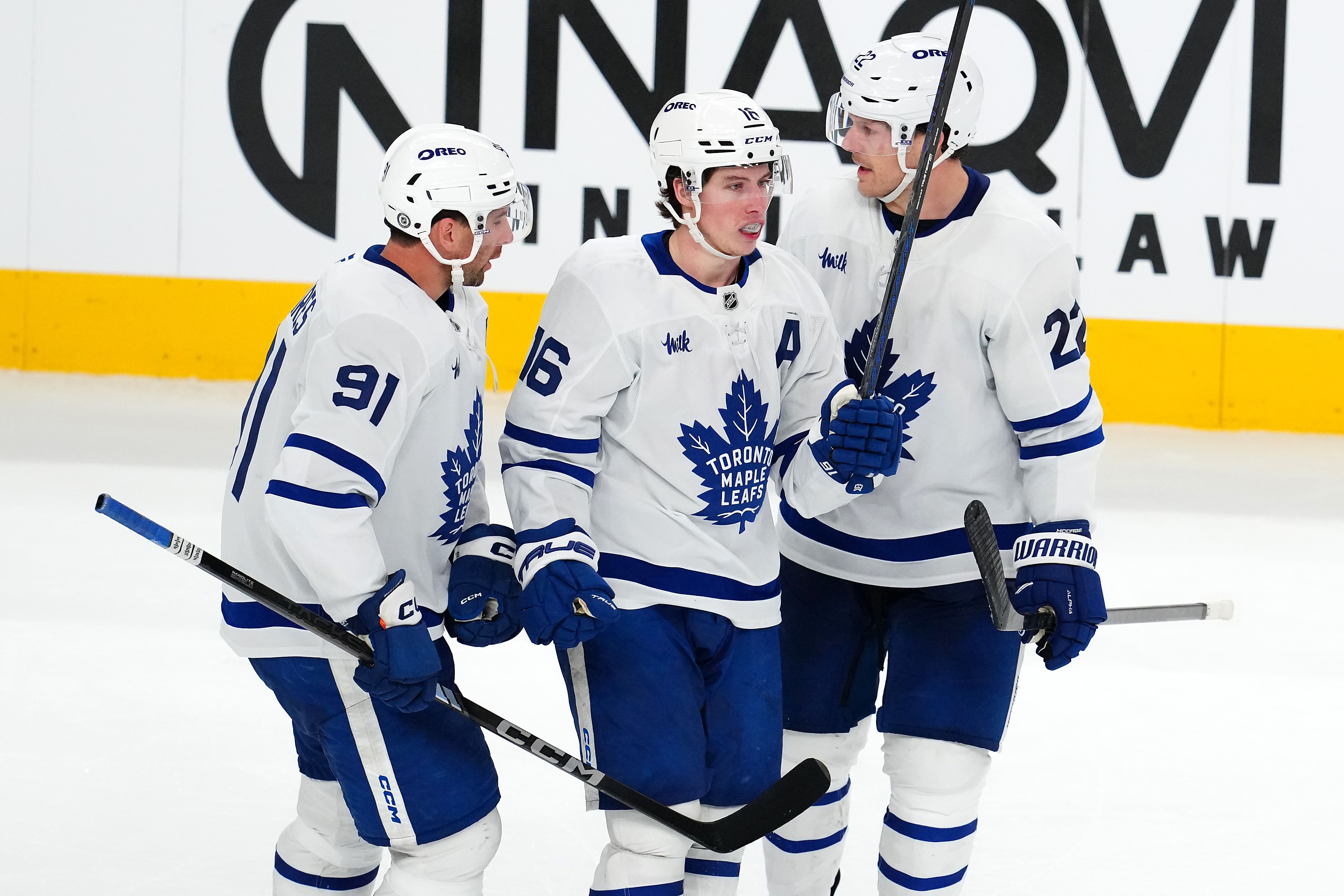 Mar 5, 2025; Las Vegas, Nevada, USA; Toronto Maple Leafs right wing Mitch Marner (16) celebrates with Toronto Maple Leafs center John Tavares (91) and Toronto Maple Leafs defenseman Jake McCabe (22) after scoring a goal against the Vegas Golden Knights during the third period at T-Mobile Arena. Mandatory Credit: Stephen R. Sylvanie-Imagn Images - Source: Imagn