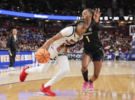 South Carolina Gamecocks guard MiLaysia Fulwiley (#12) attacks the defense of Vanderbilt Commodores guard Mikayla Blakes (1) during the second half at Bon Secours Wellness Arena. Photo: Imagn