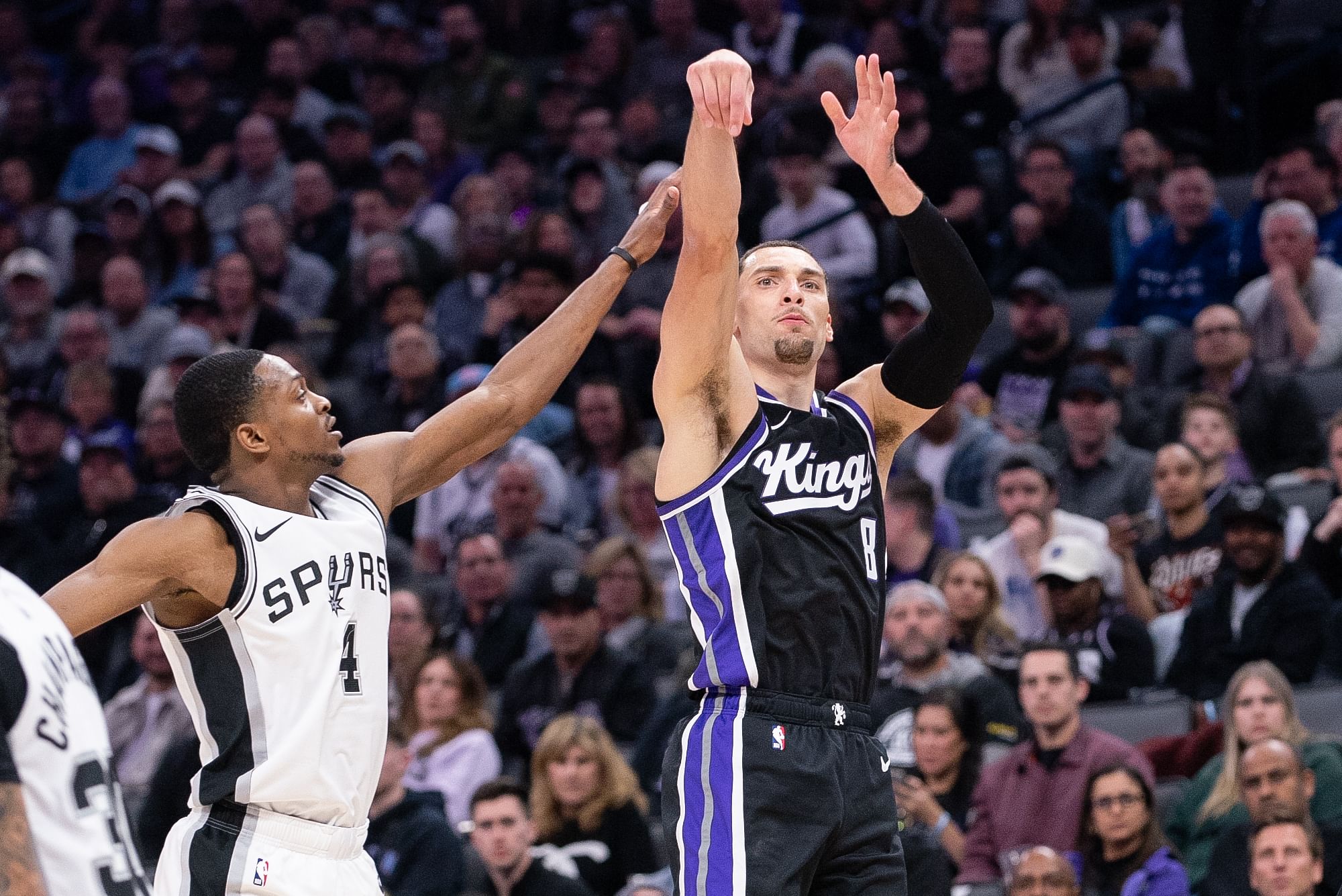 Sacramento Kings guard Zach LaVine (8) takes a three-point shot over San Antonio Spurs guard De&#039;Aaron Fox (4) during the NBA game on Friday. (Credits: IMAGN)