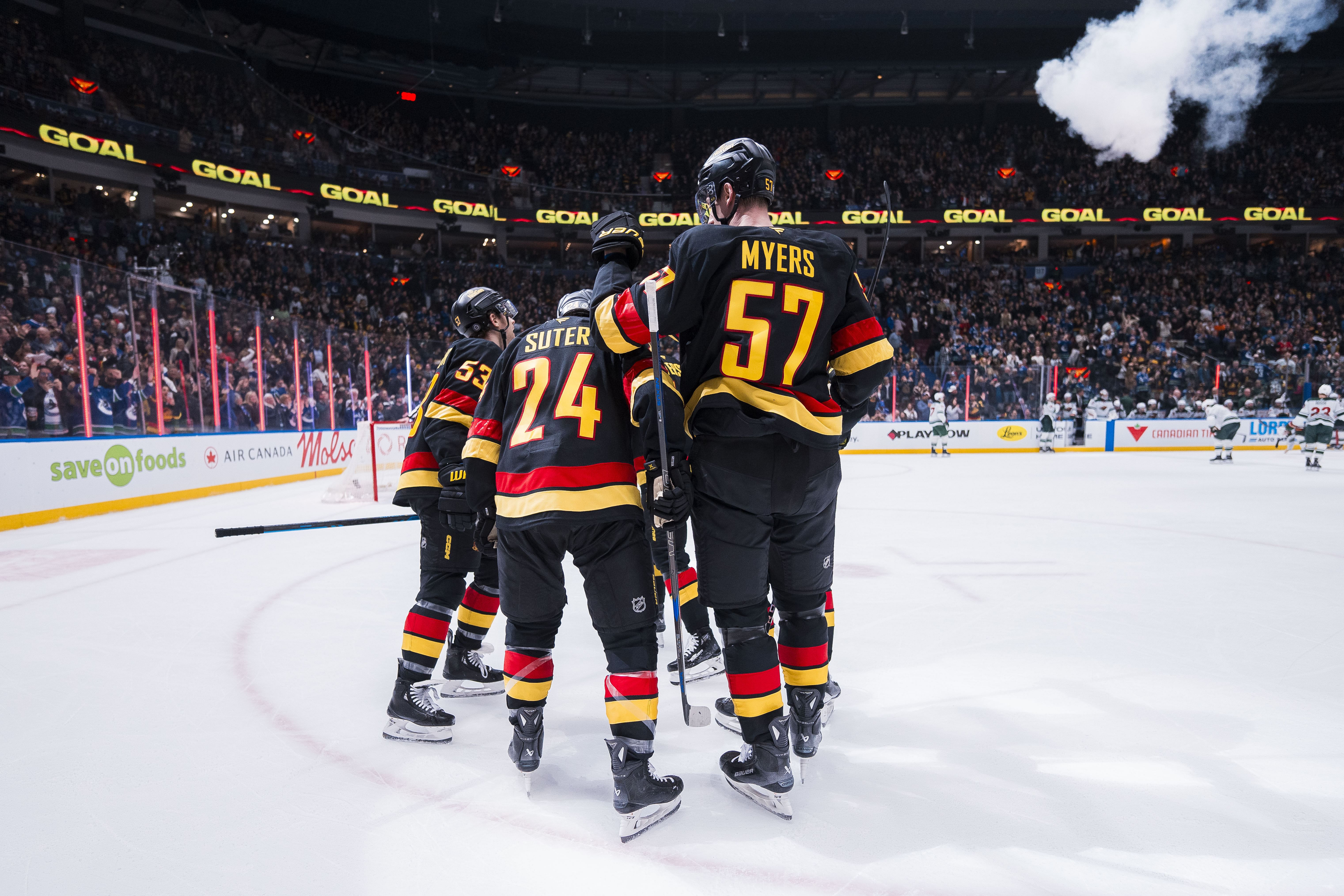 Mar 7, 2025; Vancouver, British Columbia, CAN; Vancouver Canucks forward Teddy Blueger (53) and forward Pius Suter (24) and defenseman Tyler Myers (57) and forward Elias Pettersson (40) and defenseman Marcus Pettersson (29) celebrate Blueger&rsquo;s goal against the Minnesota Wild in the third period at Rogers Arena. Mandatory Credit: Bob Frid-Imagn Images - Source: Imagn