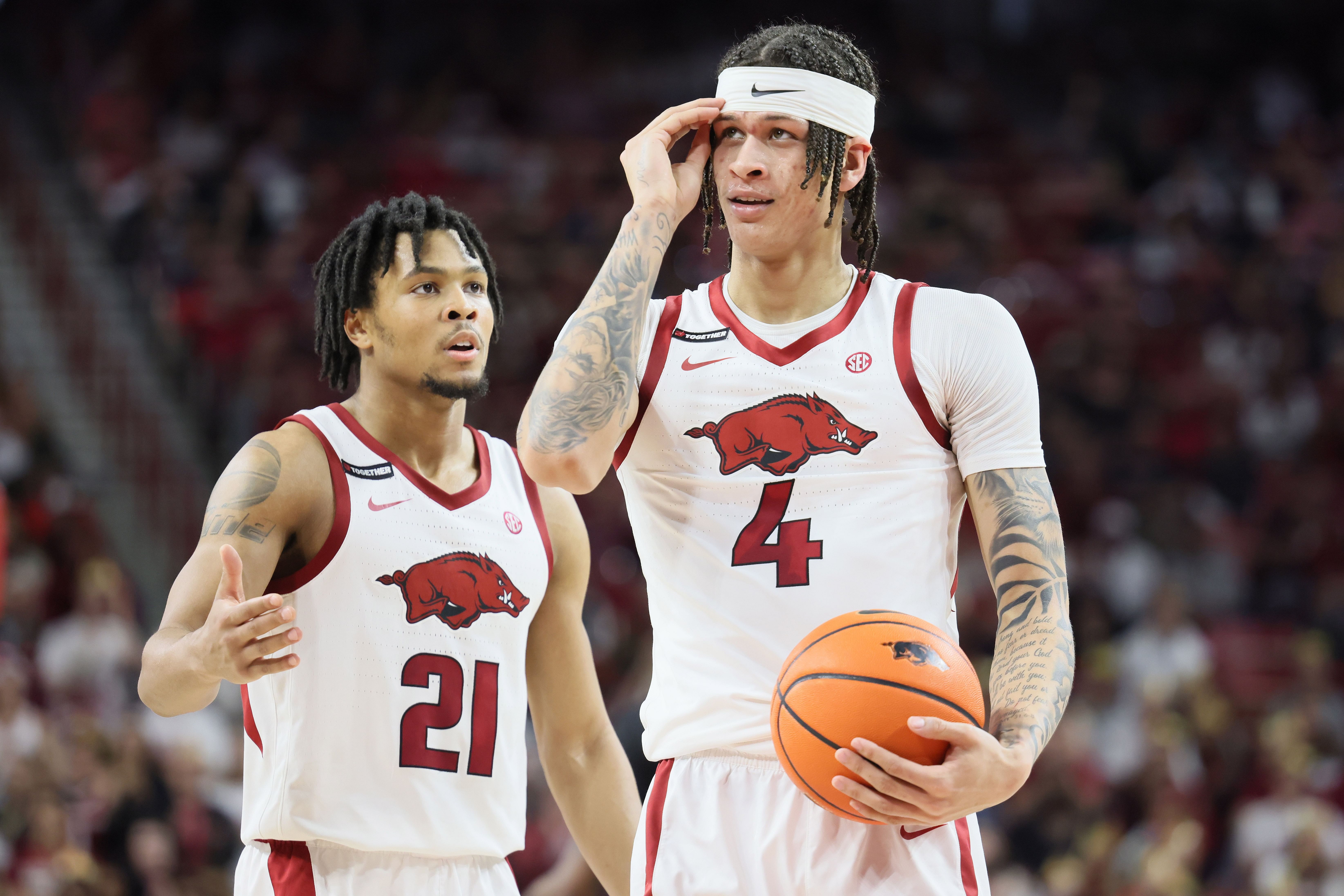 D.J. Wagner (21) and Trevon Brazile (4) in action against the Mississippi State Bulldogs at Bud Walton Arena. Photo: Imagn