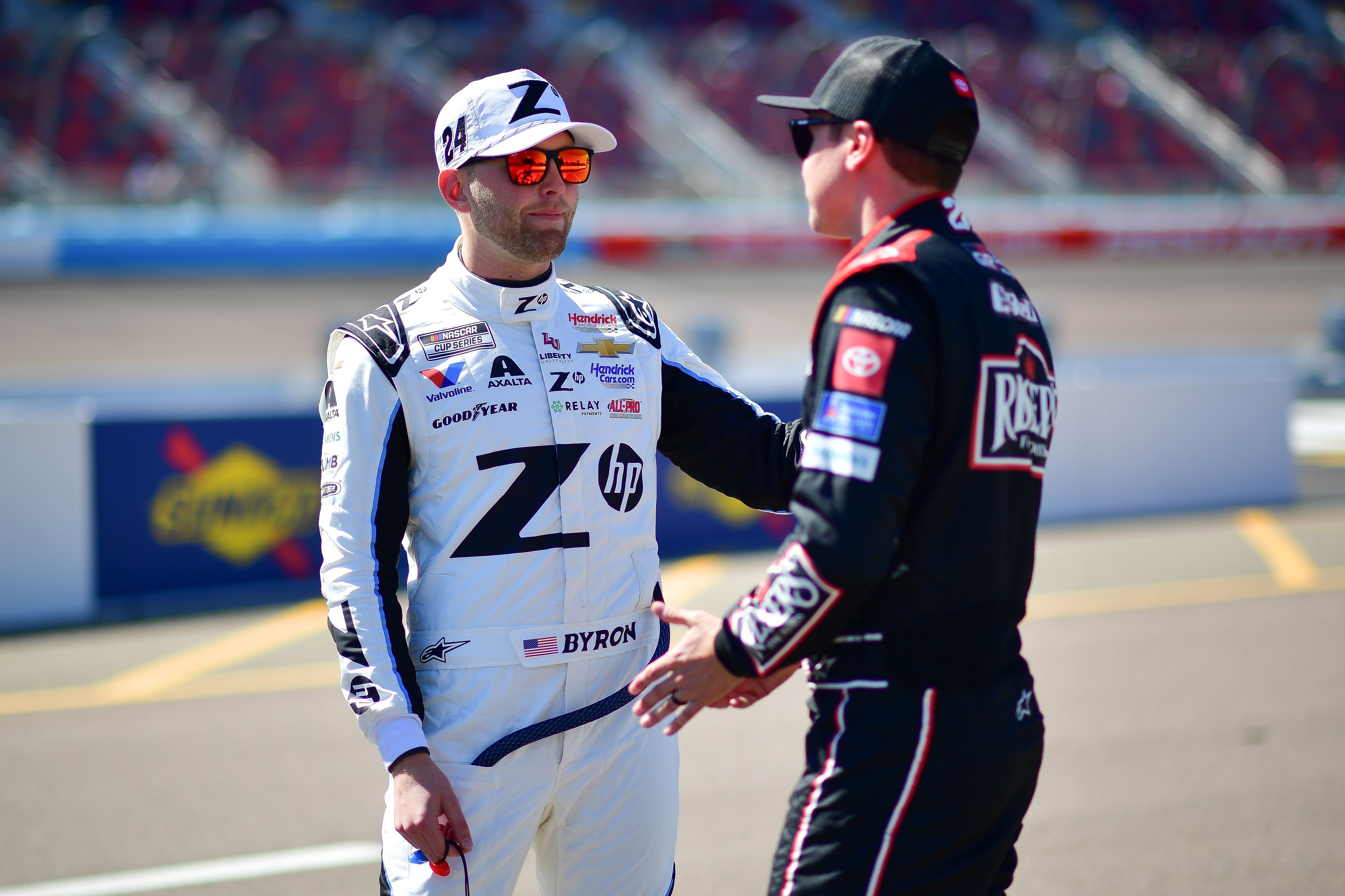 William Byron chatting with Christopher Bell during the qualifying session at Phoenix - Source: Imagn