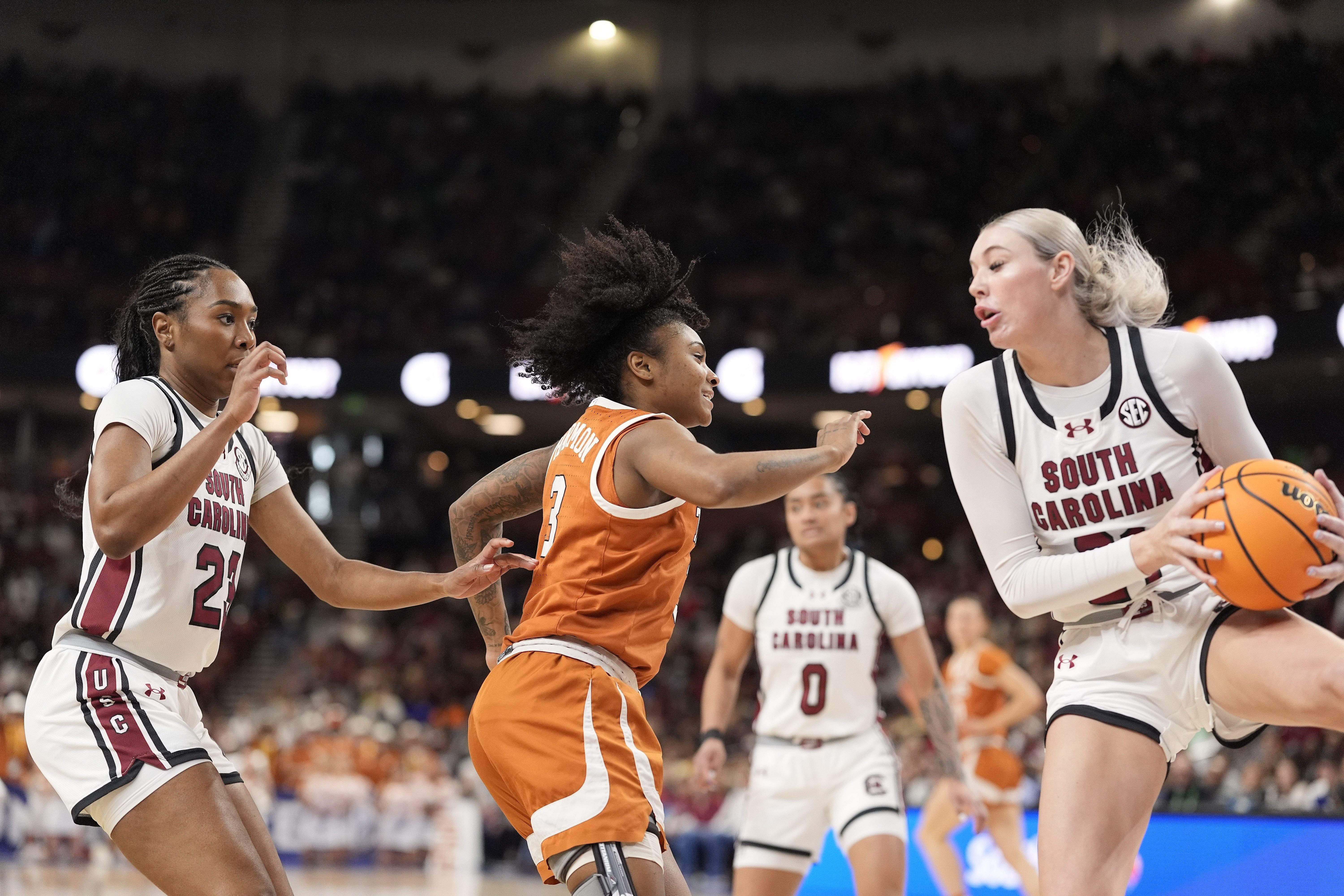 South Carolina Gamecocks forward Chloe Kitts (#21) grabs the rebound from Texas Longhorns guard Rori Harmon (#3) during the first half at Bon Secours Wellness Arena. Photo: Imagn