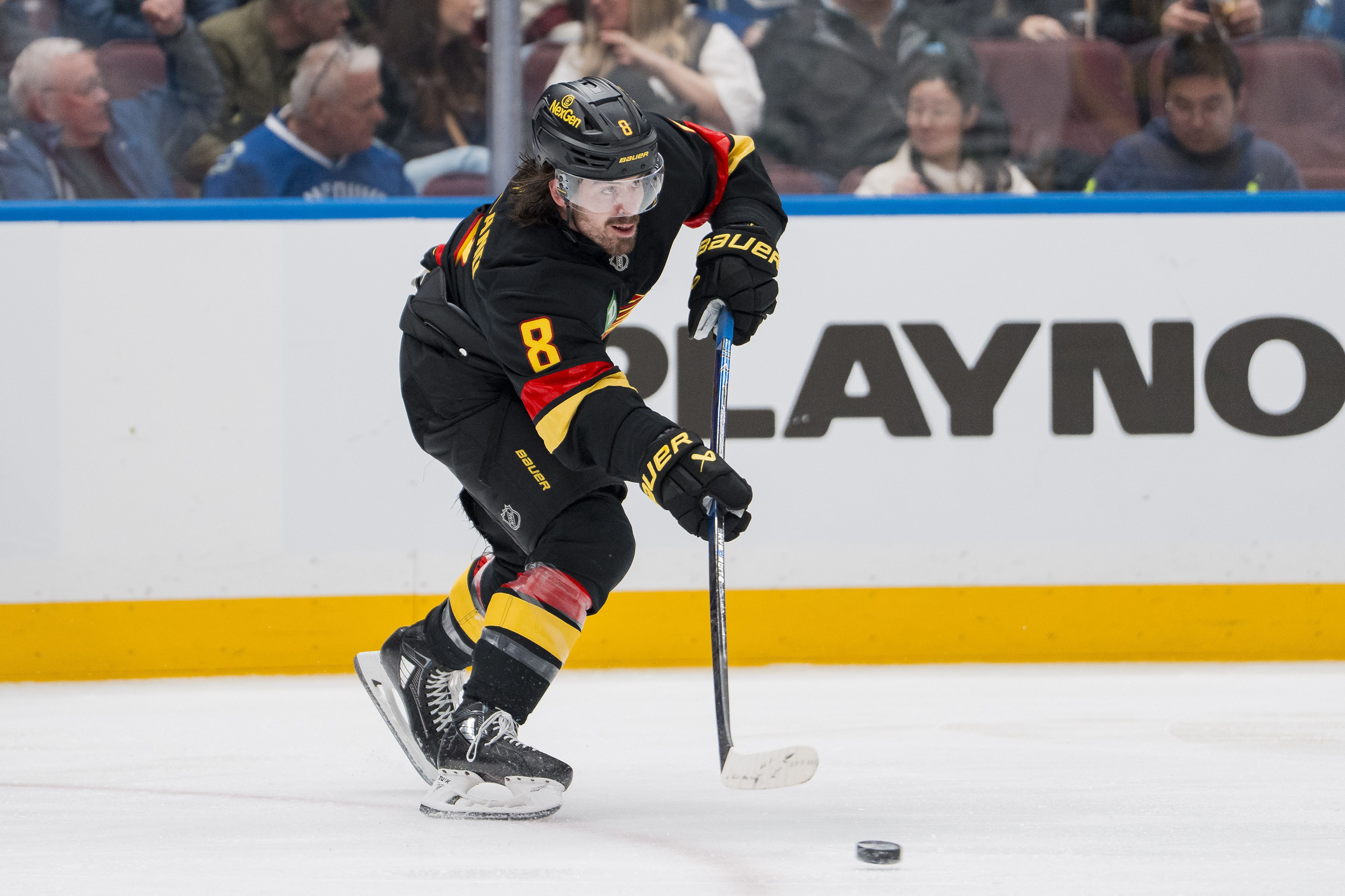 Mar 9, 2025; Vancouver, British Columbia, CAN; Vancouver Canucks forward Conor Garland (8) makes a pass against the Dallas Stars in the third period at Rogers Arena. Mandatory Credit: Bob Frid-Imagn Images - Source: Imagn