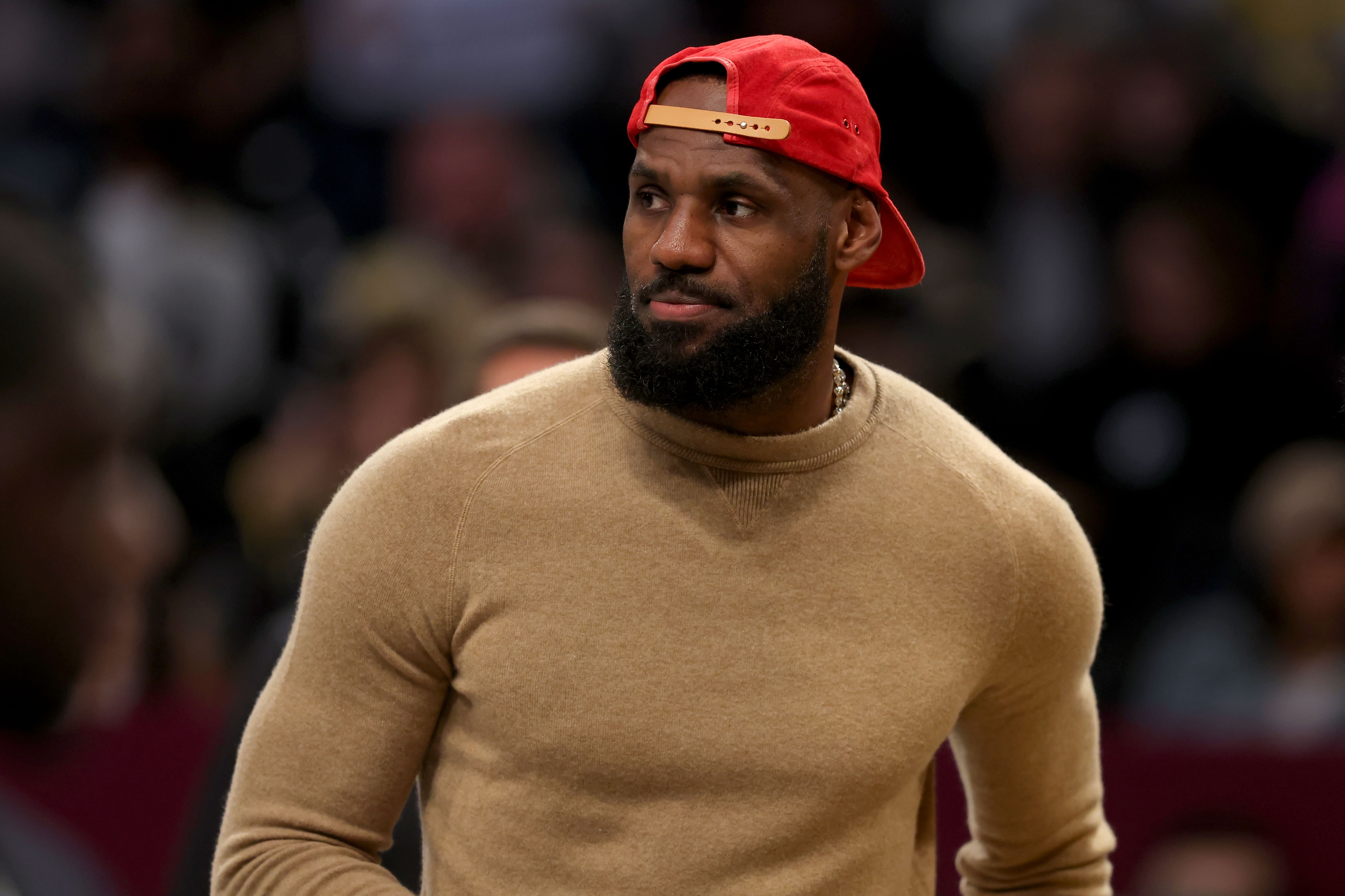 Mar 10, 2025; Brooklyn, New York, USA; Los Angeles Lakers injured forward LeBron James (23) on the court during a time out during the first quarter against the Brooklyn Nets at Barclays Center. Mandatory Credit: Brad Penner-Imagn Images - Source: Imagn