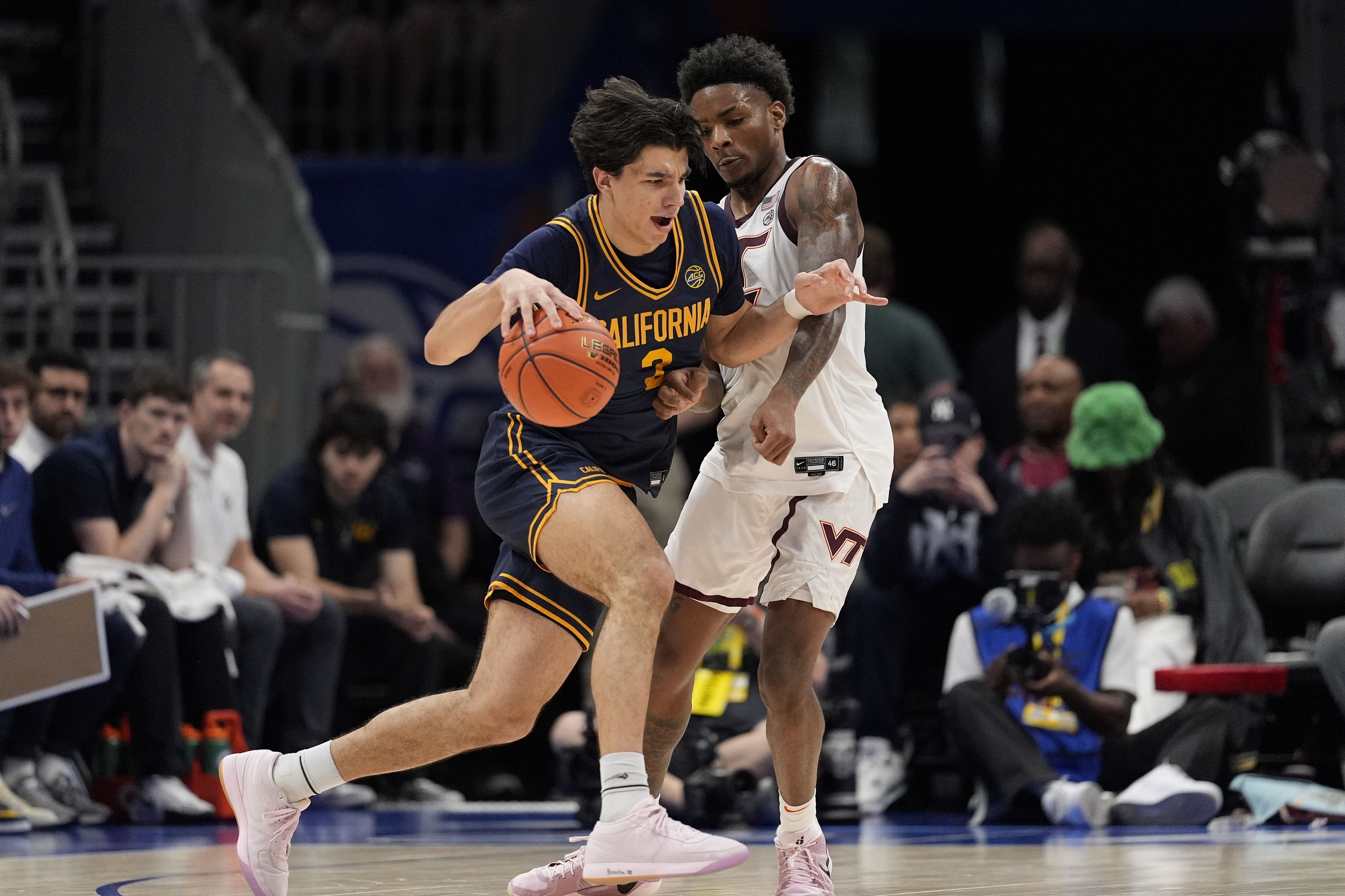 California Golden Bears guard Andrej Stojakovic (2) attacks the defense of Virginia Tech Hokies guard Jaydon Young (3) during OT at Spectrum Center. Photo: Imagn