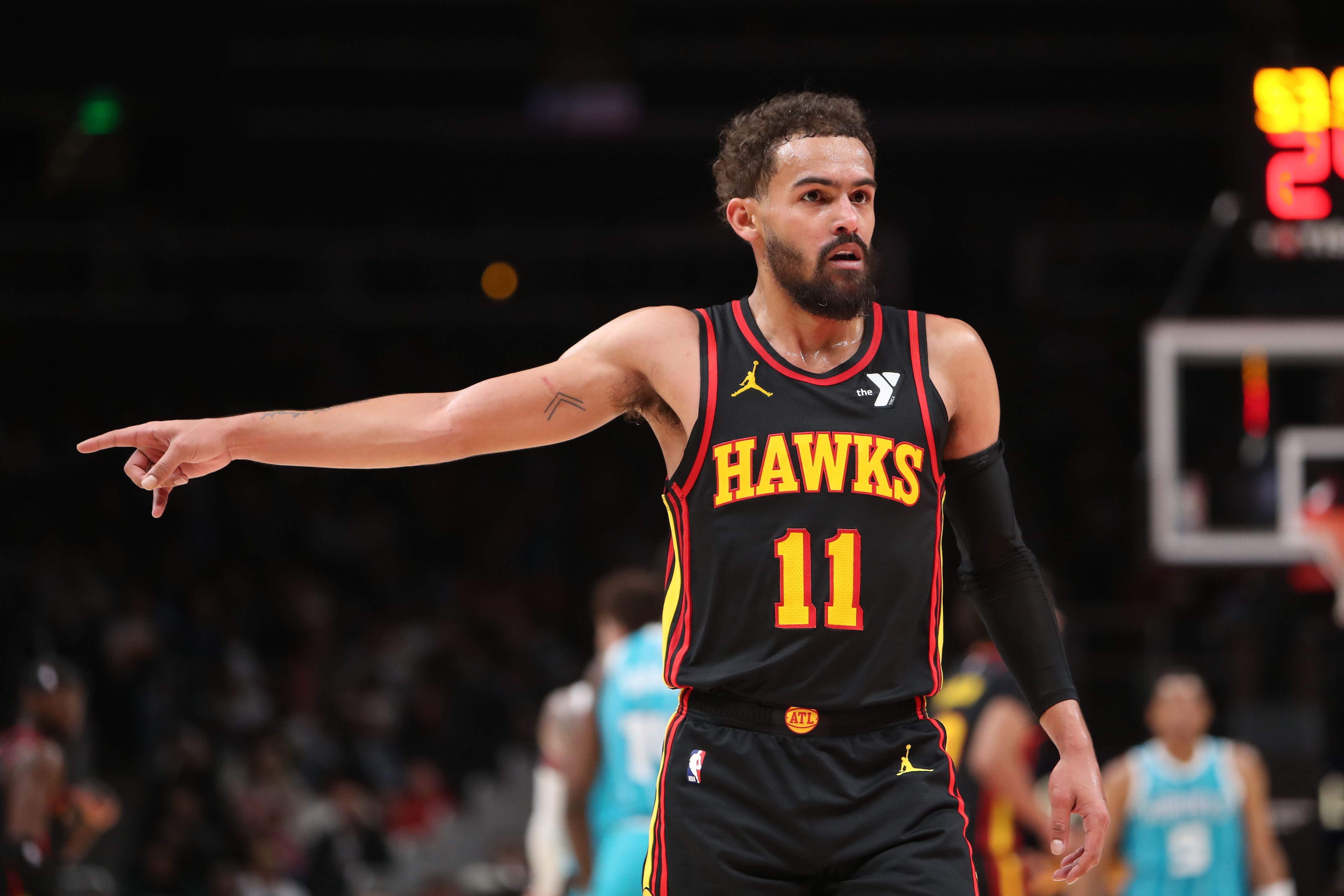 Atlanta Hawks guard Trae Young points to the referee against the Charlotte Hornets at State Farm Arena. Photo Credit: Imagn