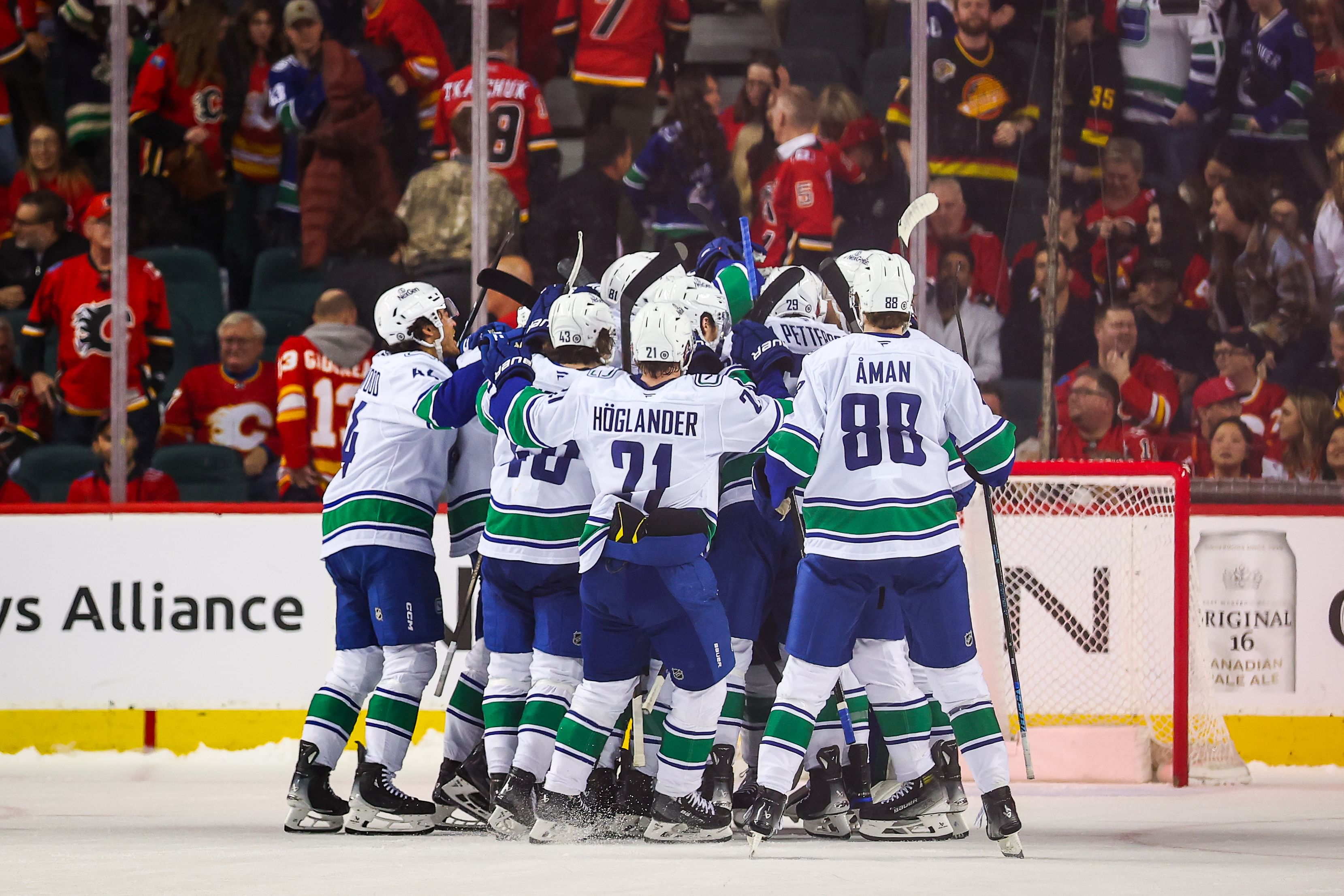 Mar 12, 2025; Calgary, Alberta, CAN; Vancouver Canucks celebrates win over the Calgary Flames in the shootout period at Scotiabank Saddledome. Mandatory Credit: Sergei Belski-Imagn Images - Source: Imagn