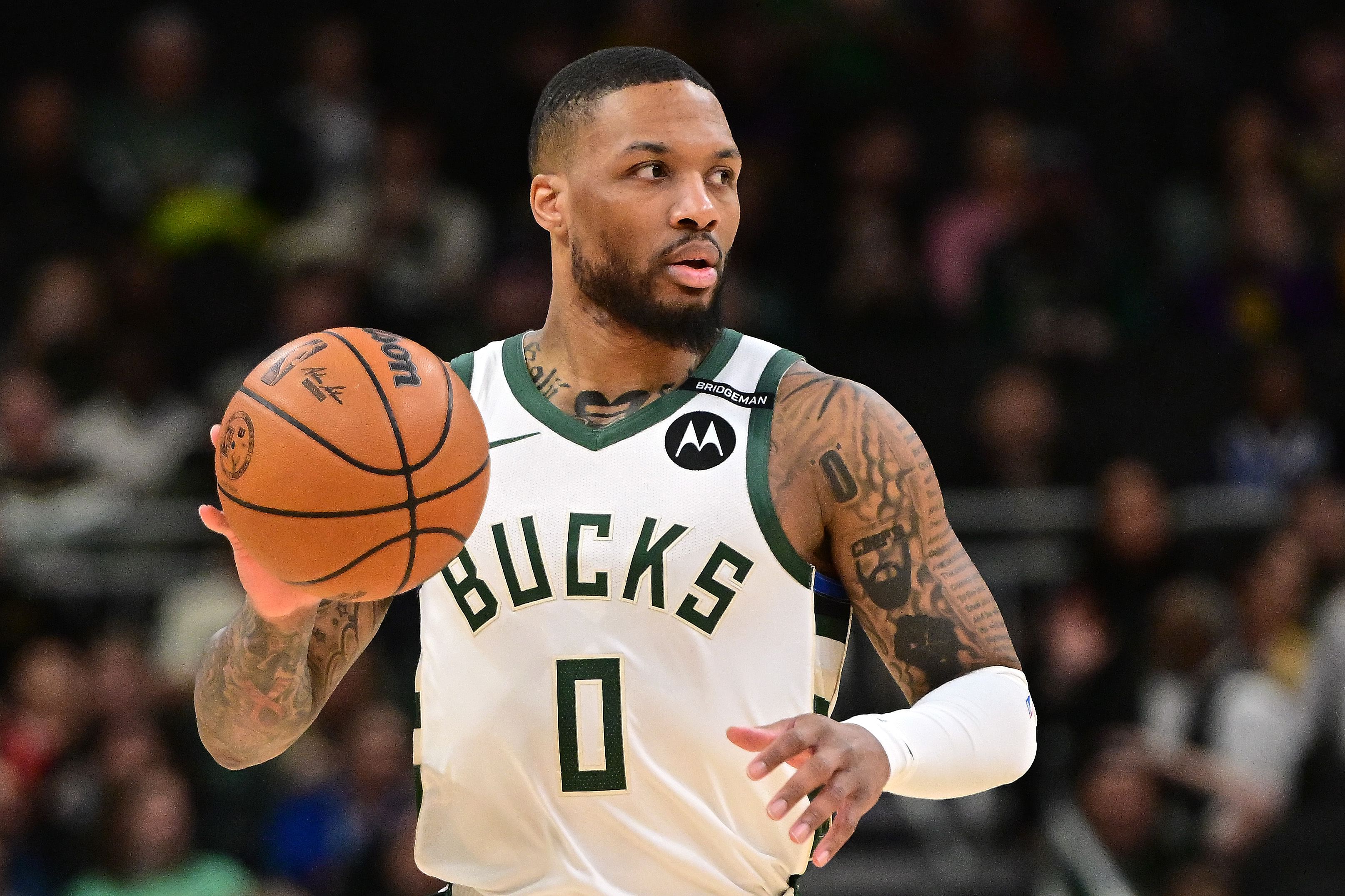 Milwaukee Bucks guard Damian Lillard dribbles the ball against the LA Lakers at Fiserv Forum. Photo Credit: Imagn