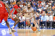 Auburn Tigers forward Johni Broome (4) dribbles past Mississippi Rebels forward Malik Dia (0) during the first half at Bridgestone Arena. Photo: Imagn