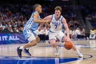 Duke Blue Devils guard Kon Knueppel (7) drives to the basket against North Carolina Tar Heels guard Seth Trimble (7) during the second half at Spectrum Center. Photo: Imagn