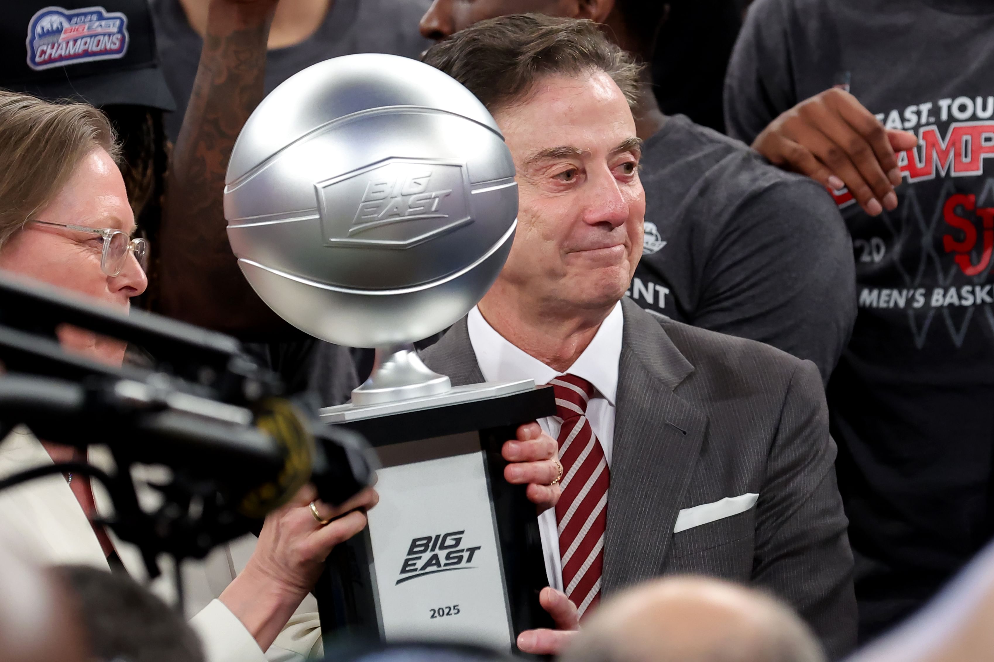 Big East Conference commissioner Val Ackerman (left) hands the championship trophy to St. John&#039;s Red Storm head coach Rick Pitino after St. John&#039;s defeated the Creighton Bluejays. Photo: Imagn