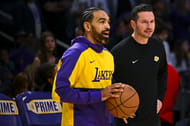 Gabe Vincent (7) talks with LA Lakers coach JJ Redick - Source: Imagn