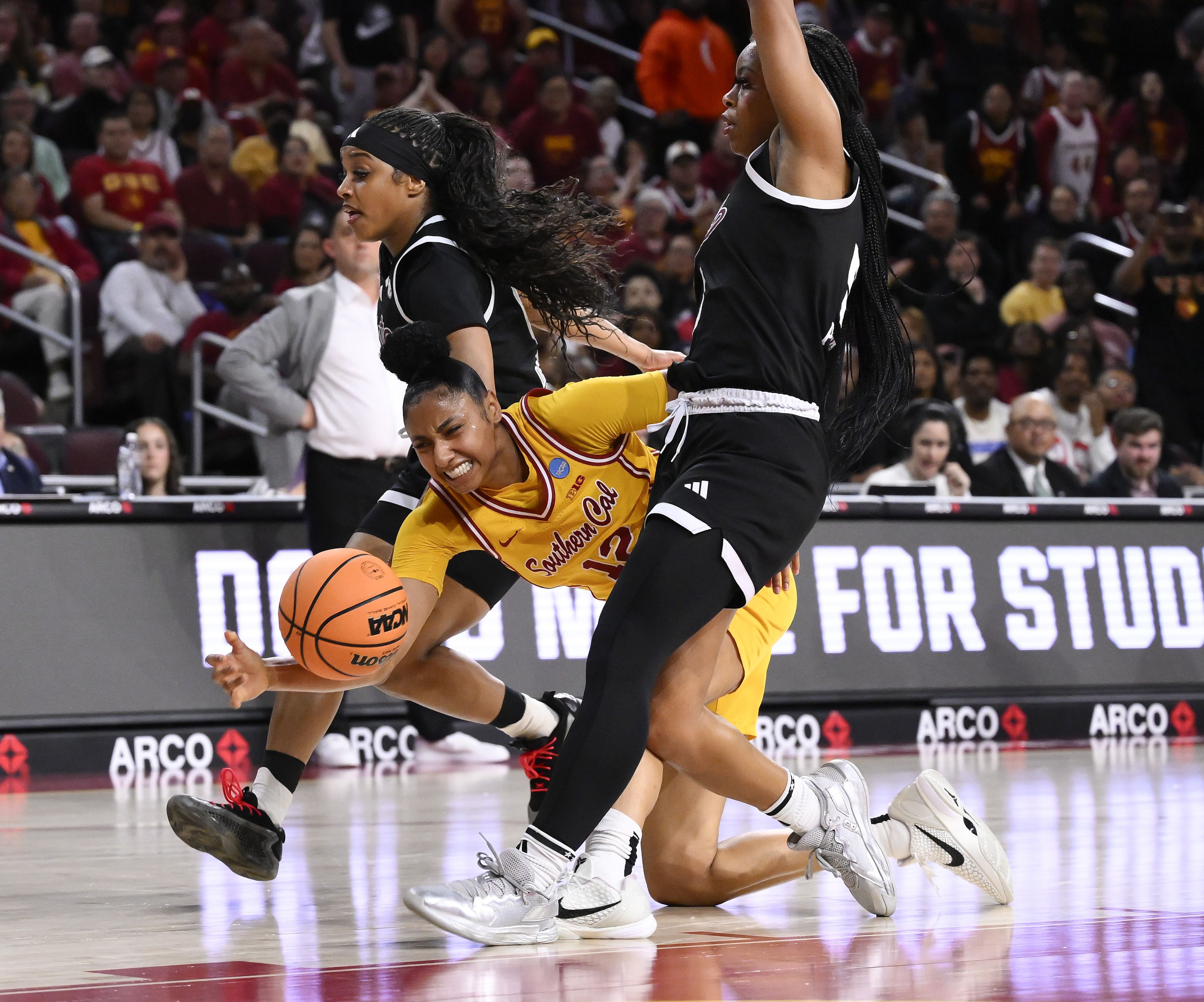 JuJu Watkins falling down while MS State players defend in transition. [NCAA Womens Basketball: NCAA Tournament Second Round USC-Mississippi State - Source: Imagn]